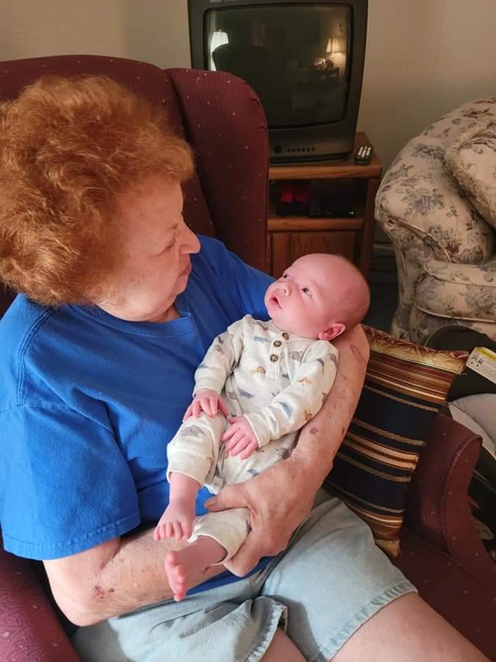 A woman holding a baby