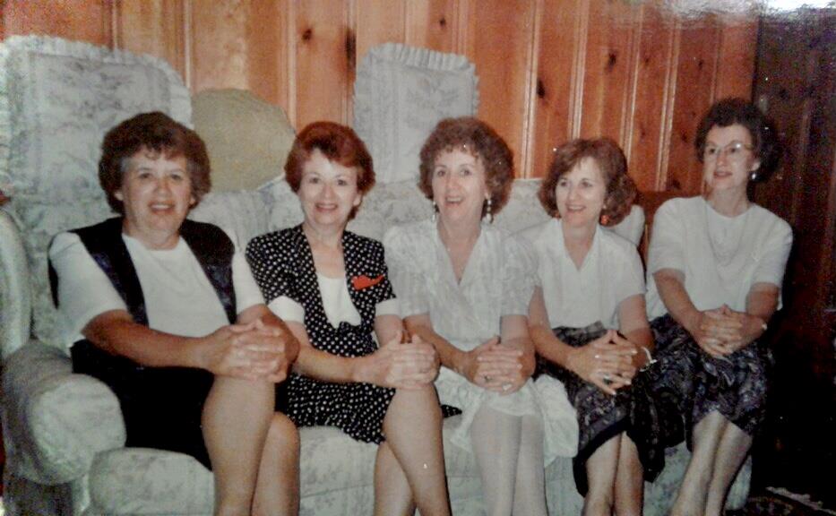 A group of women sitting on a couch