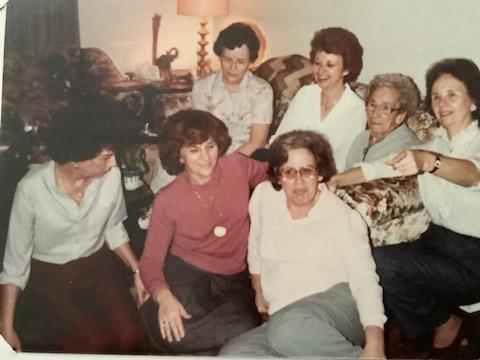 A group of women sitting on a couch