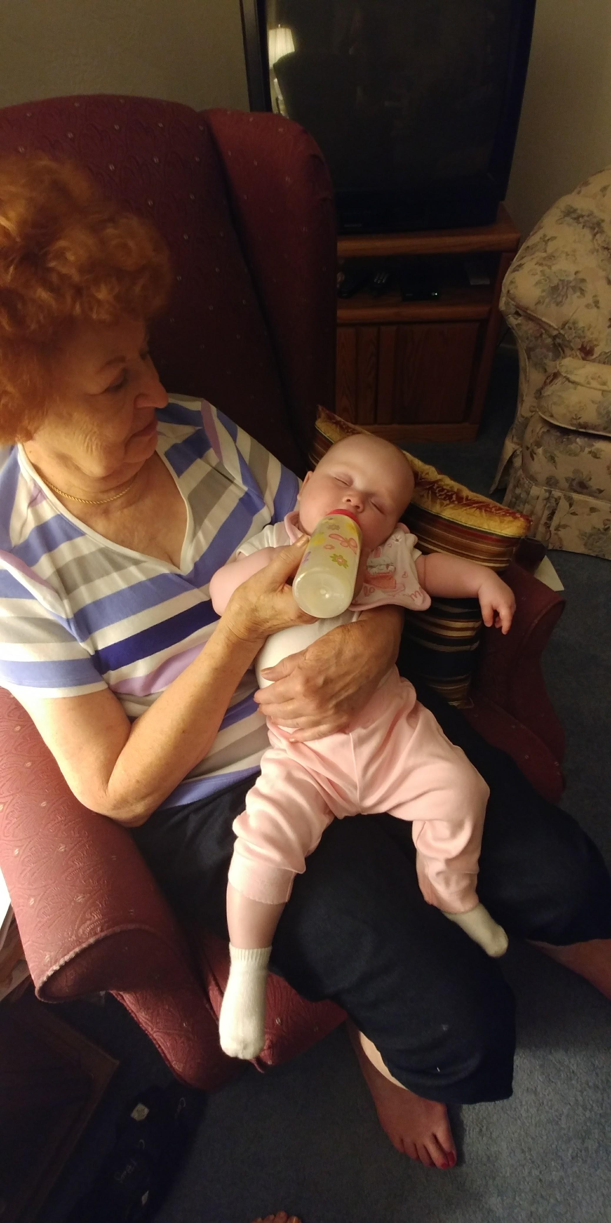 A woman holding a baby