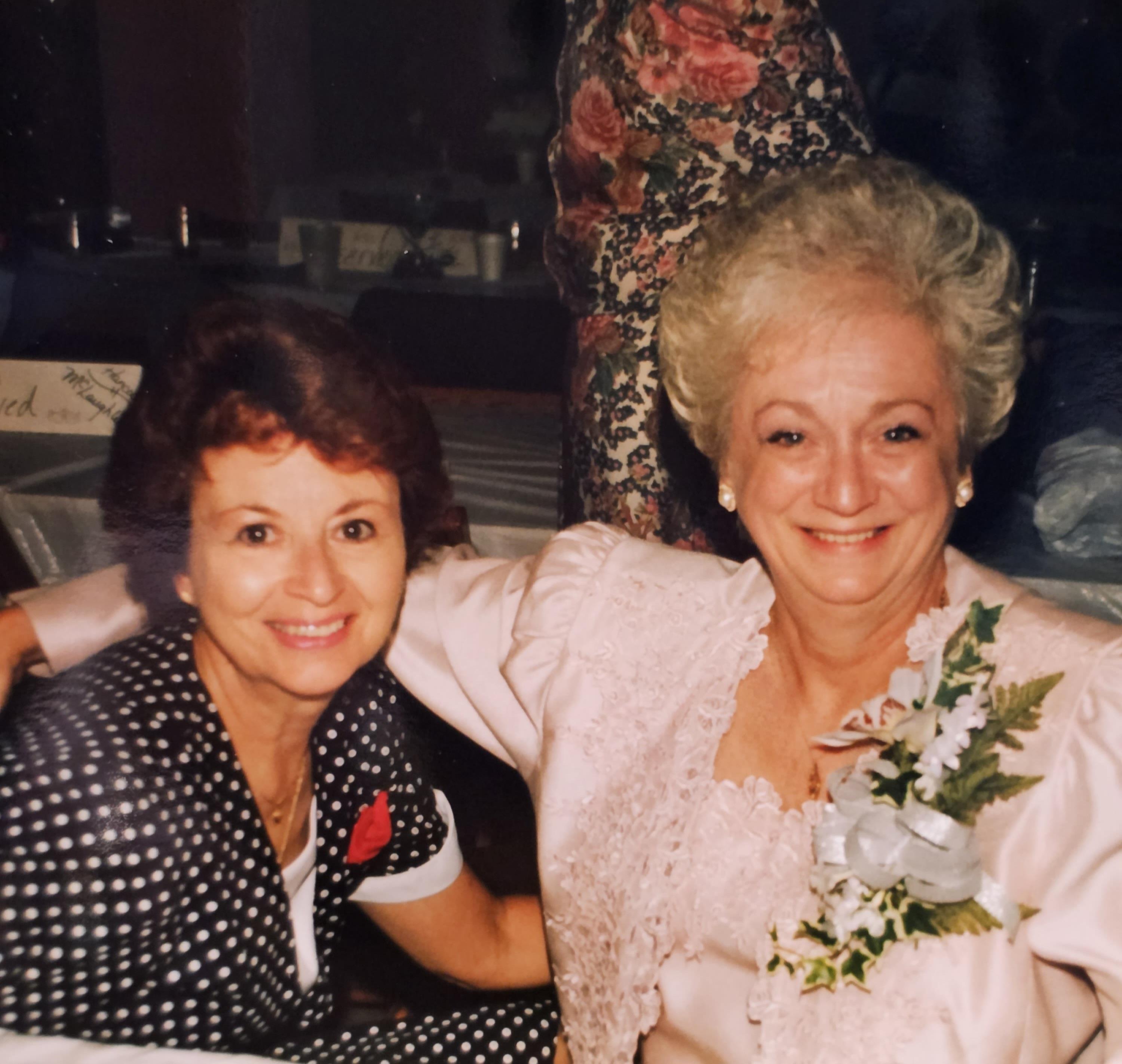 Two women smiling at the camera