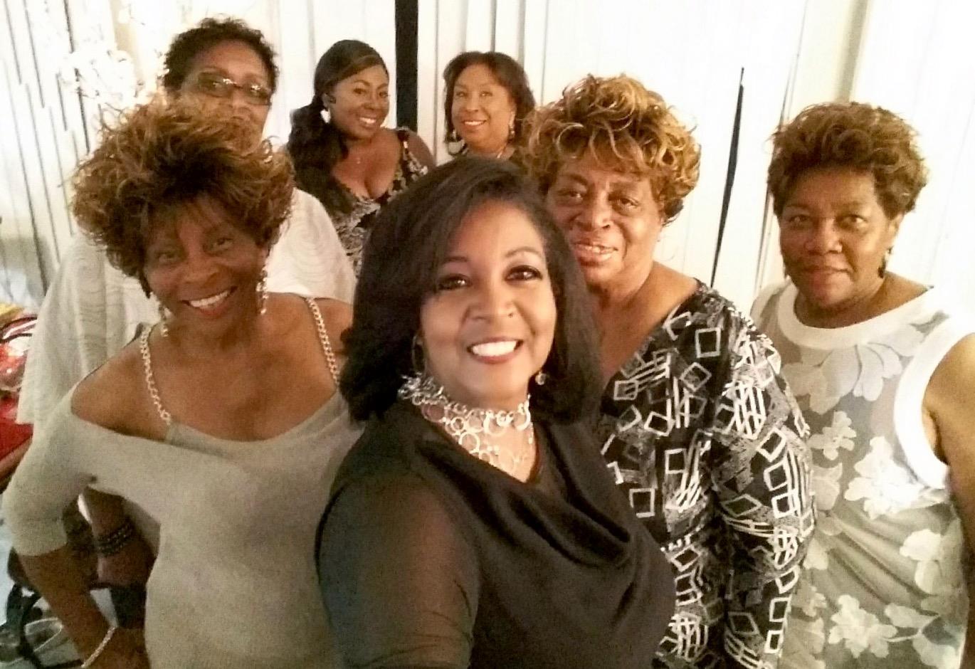 A group of women posing for a photo