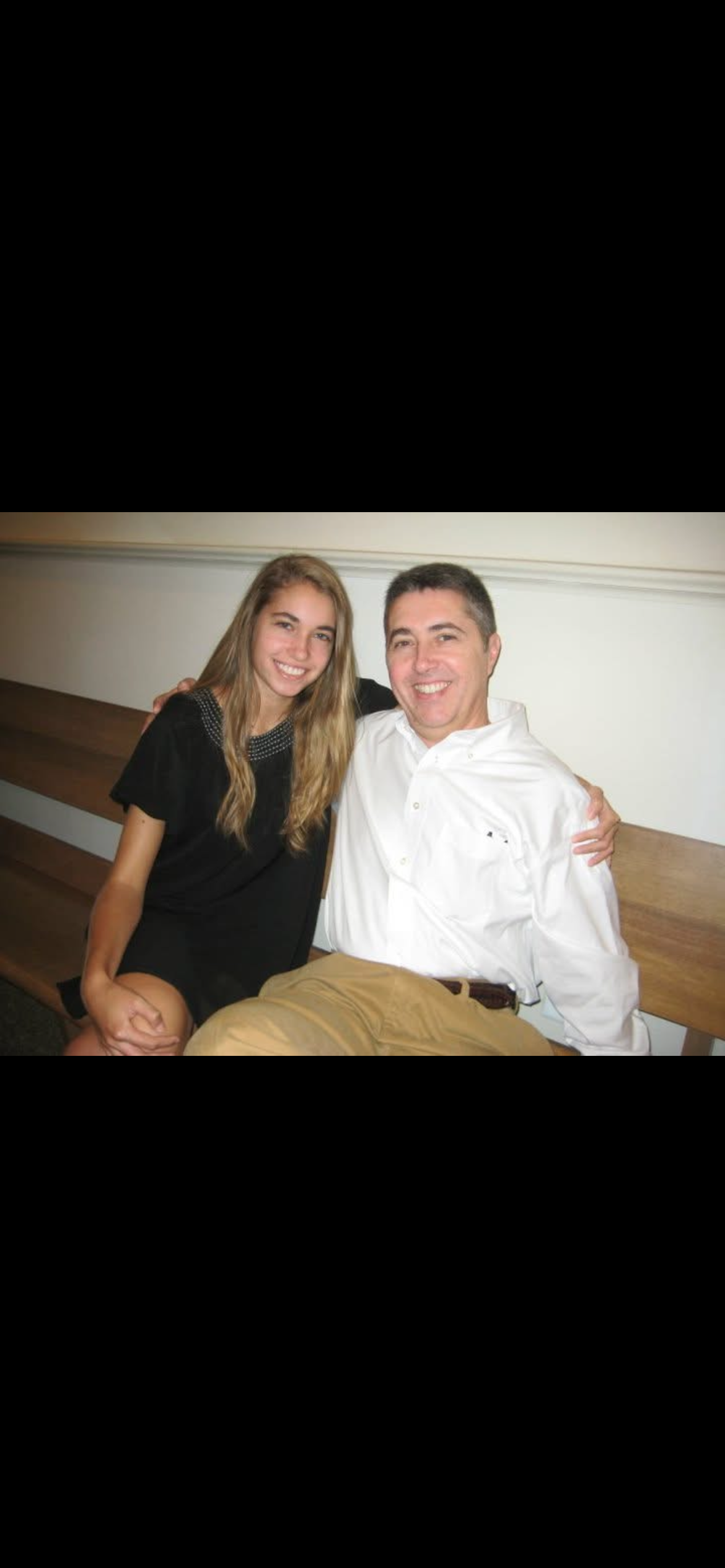 A man and woman sitting on a bench