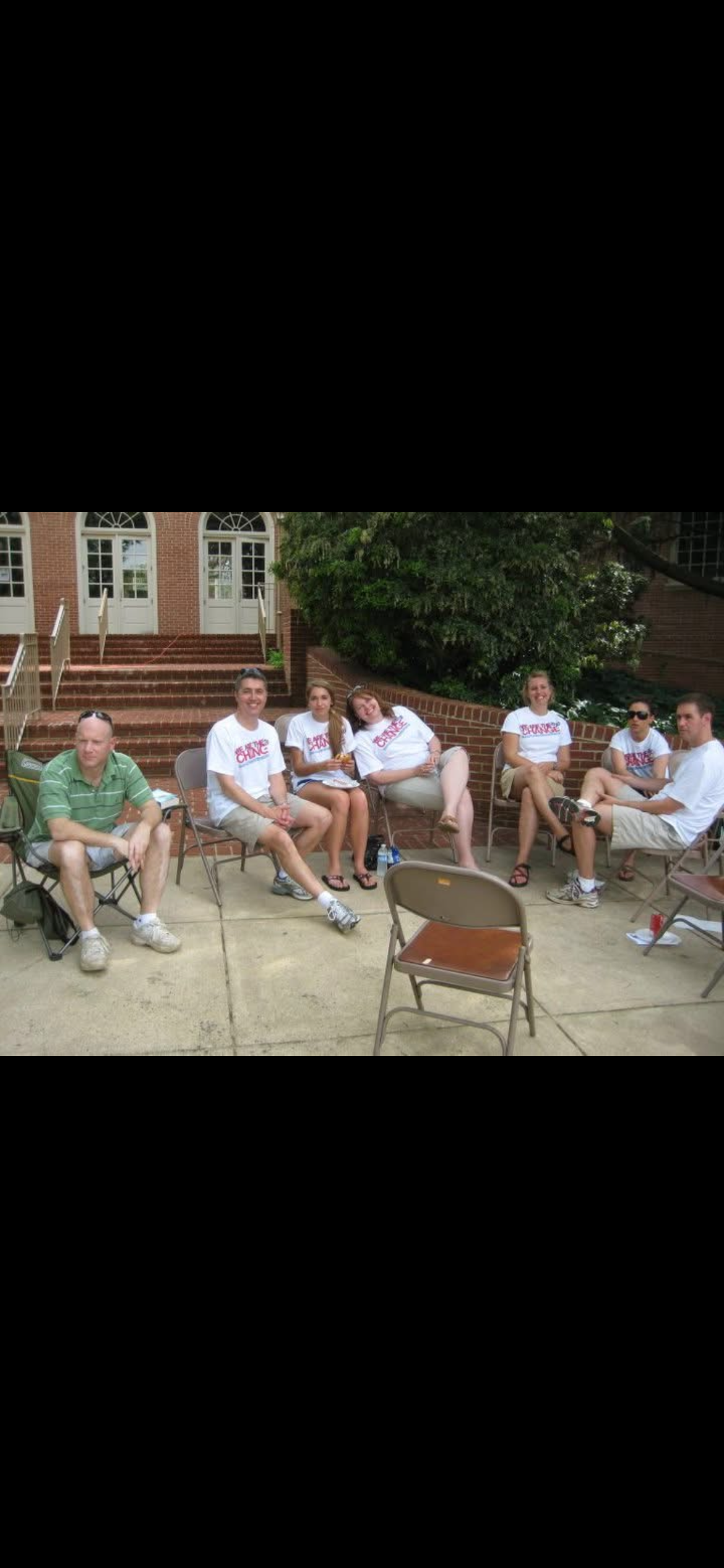 A group of people sitting on chairs