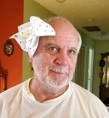 A man with a bow on his head