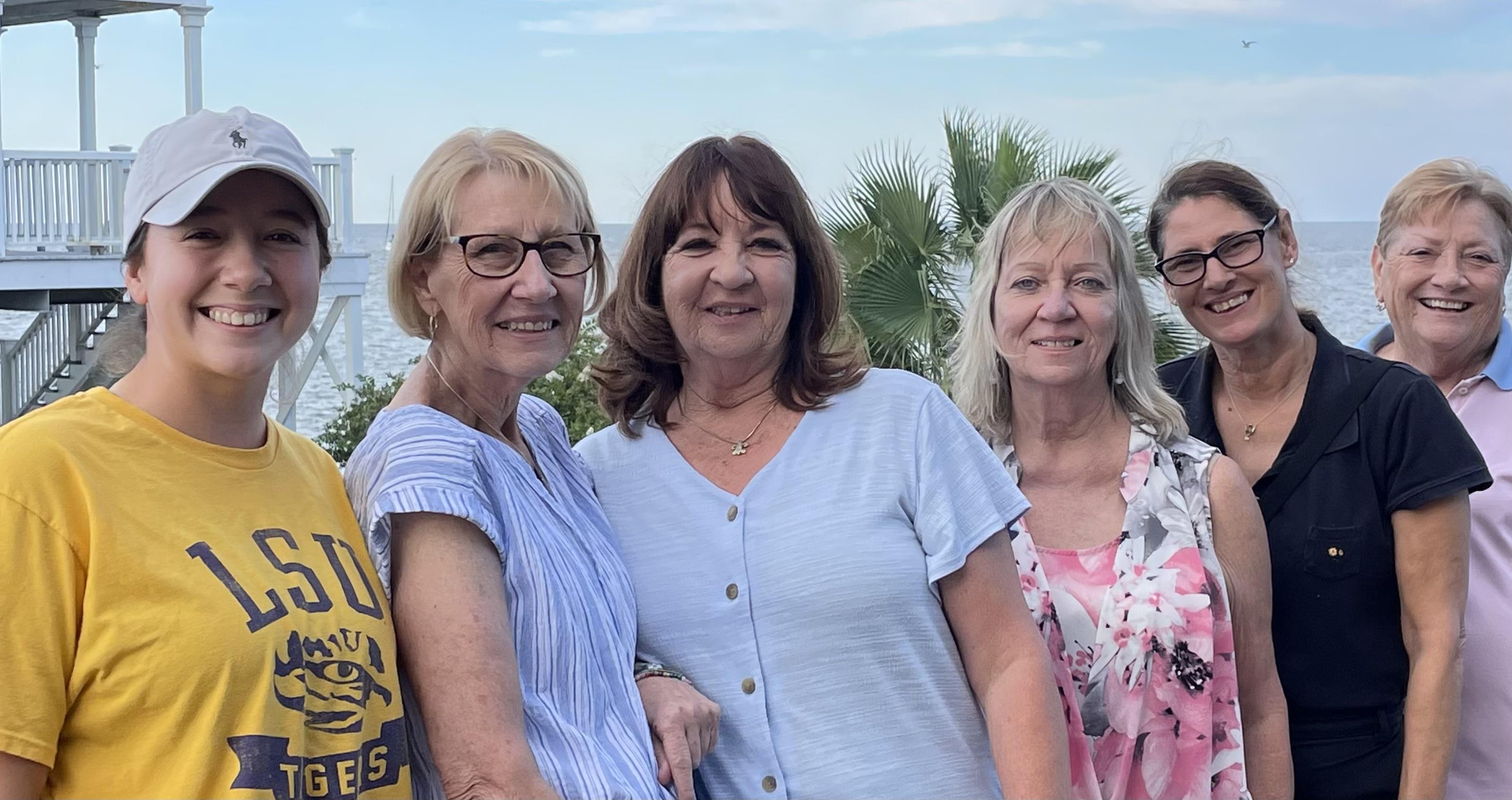 A group of women posing for a photo