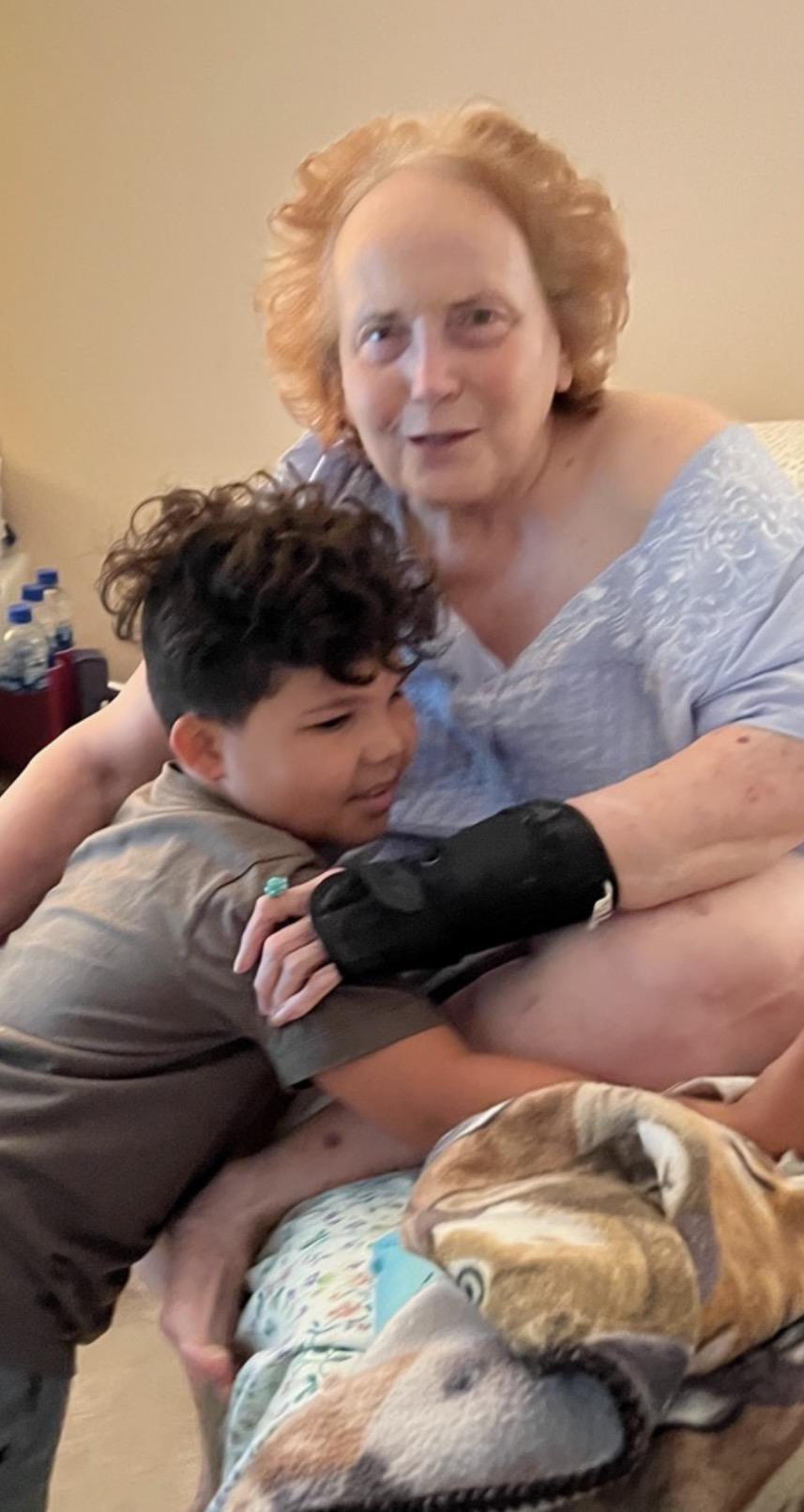 A woman holding a boy