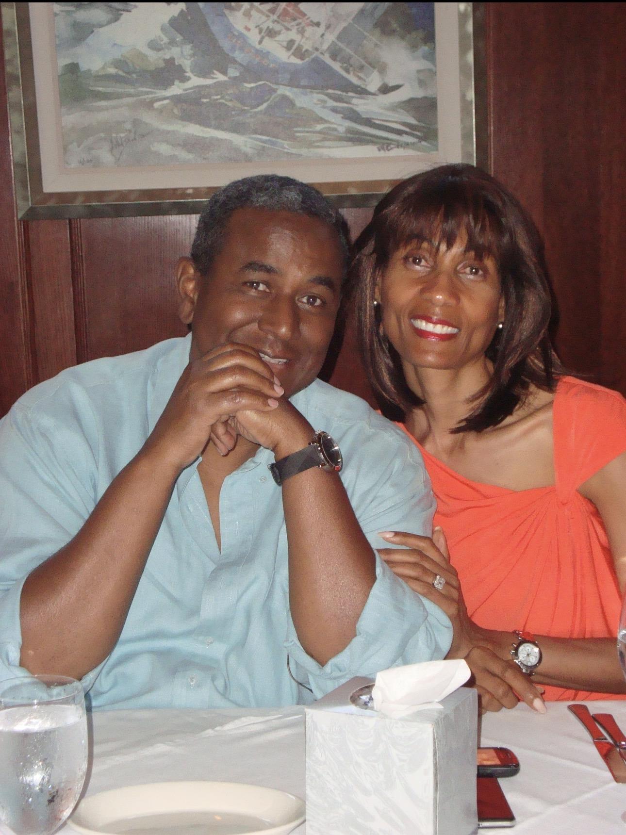 A man and woman sitting at a table