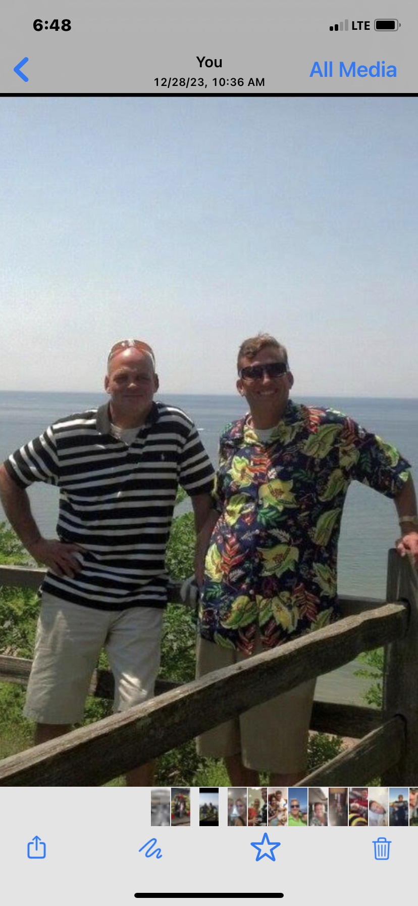 Two men standing next to each other