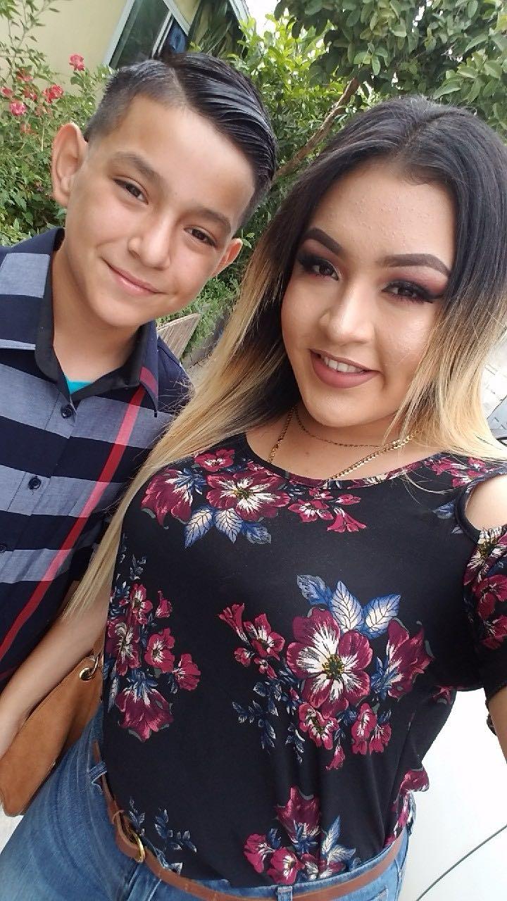 A boy and woman taking a selfie