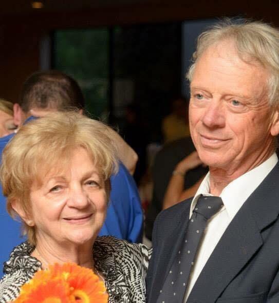 A man and woman smiling