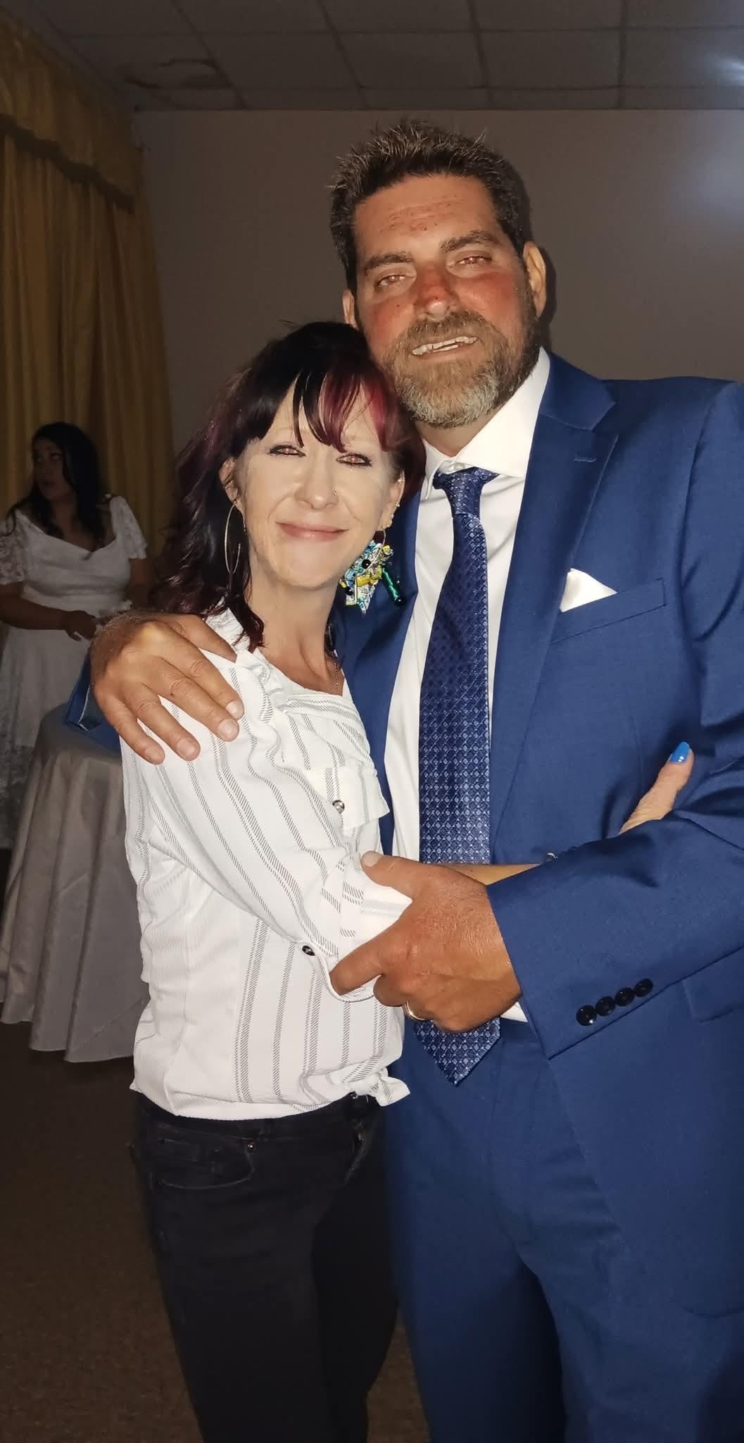 A man and woman posing for a picture