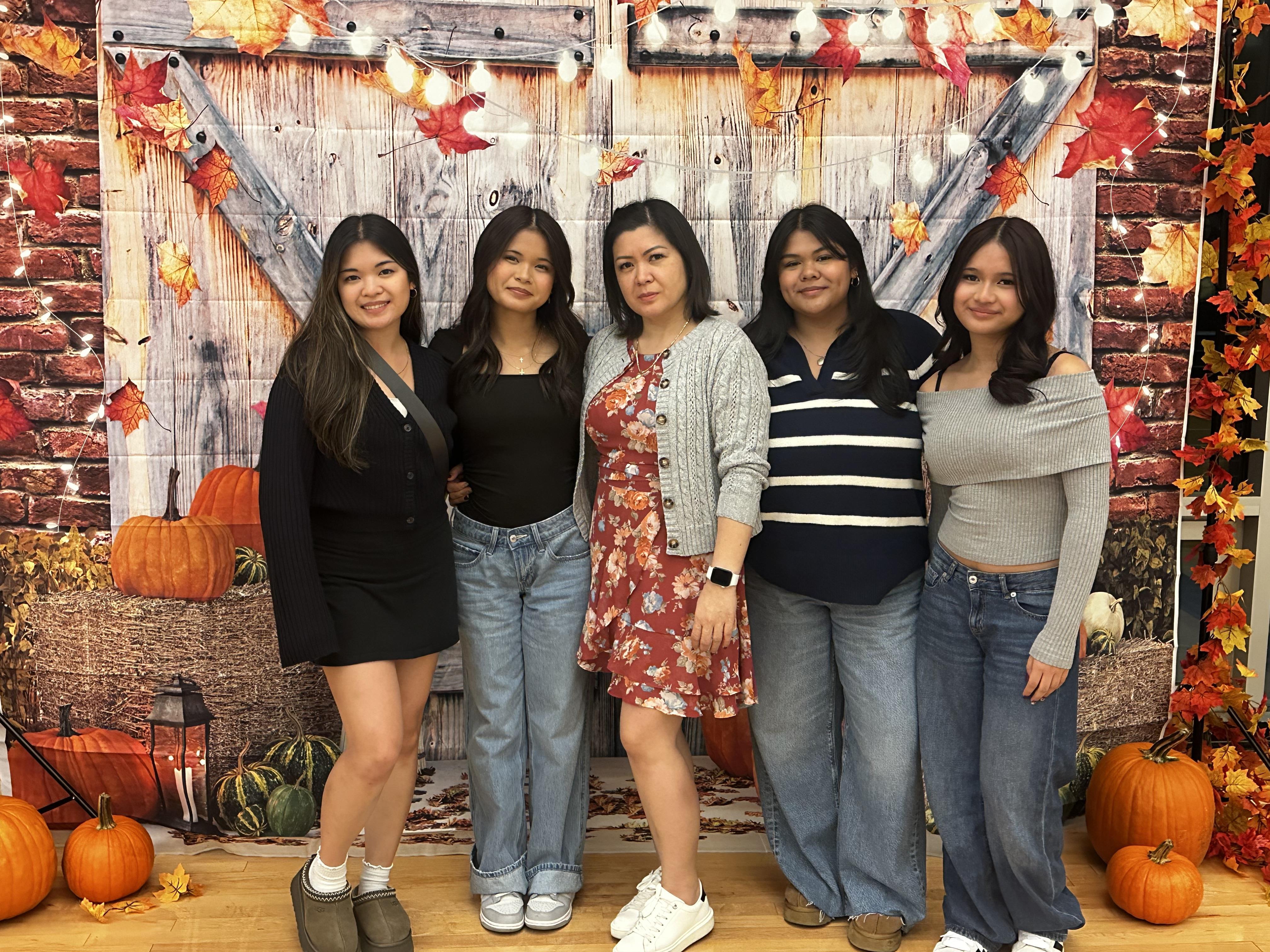 A group of women posing for a photo
