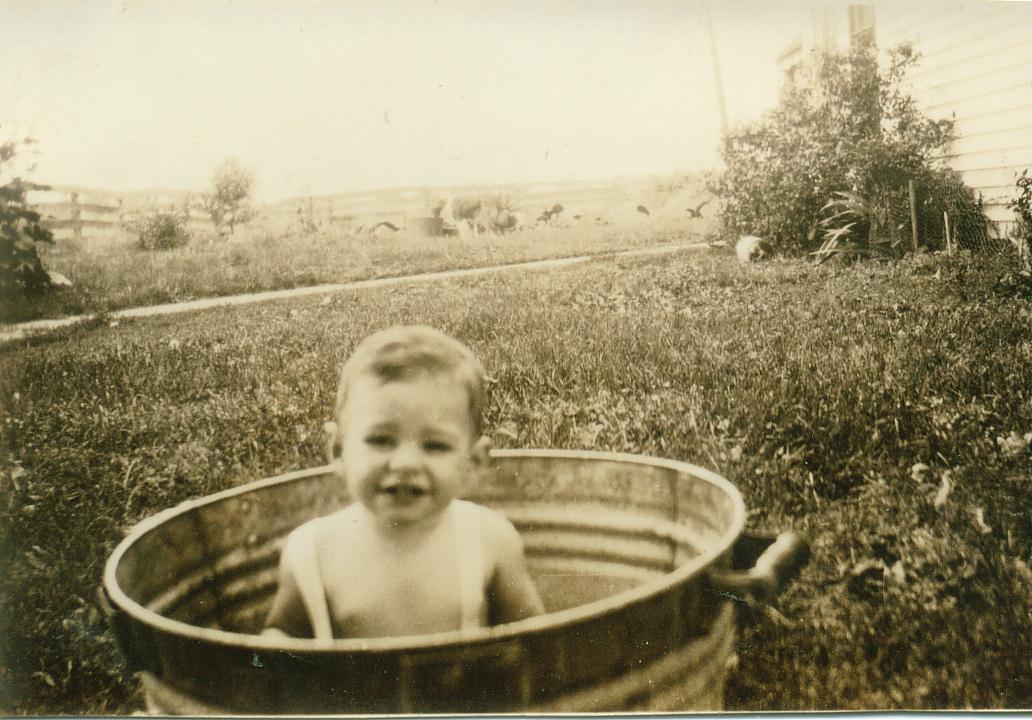 A baby in a metal tub