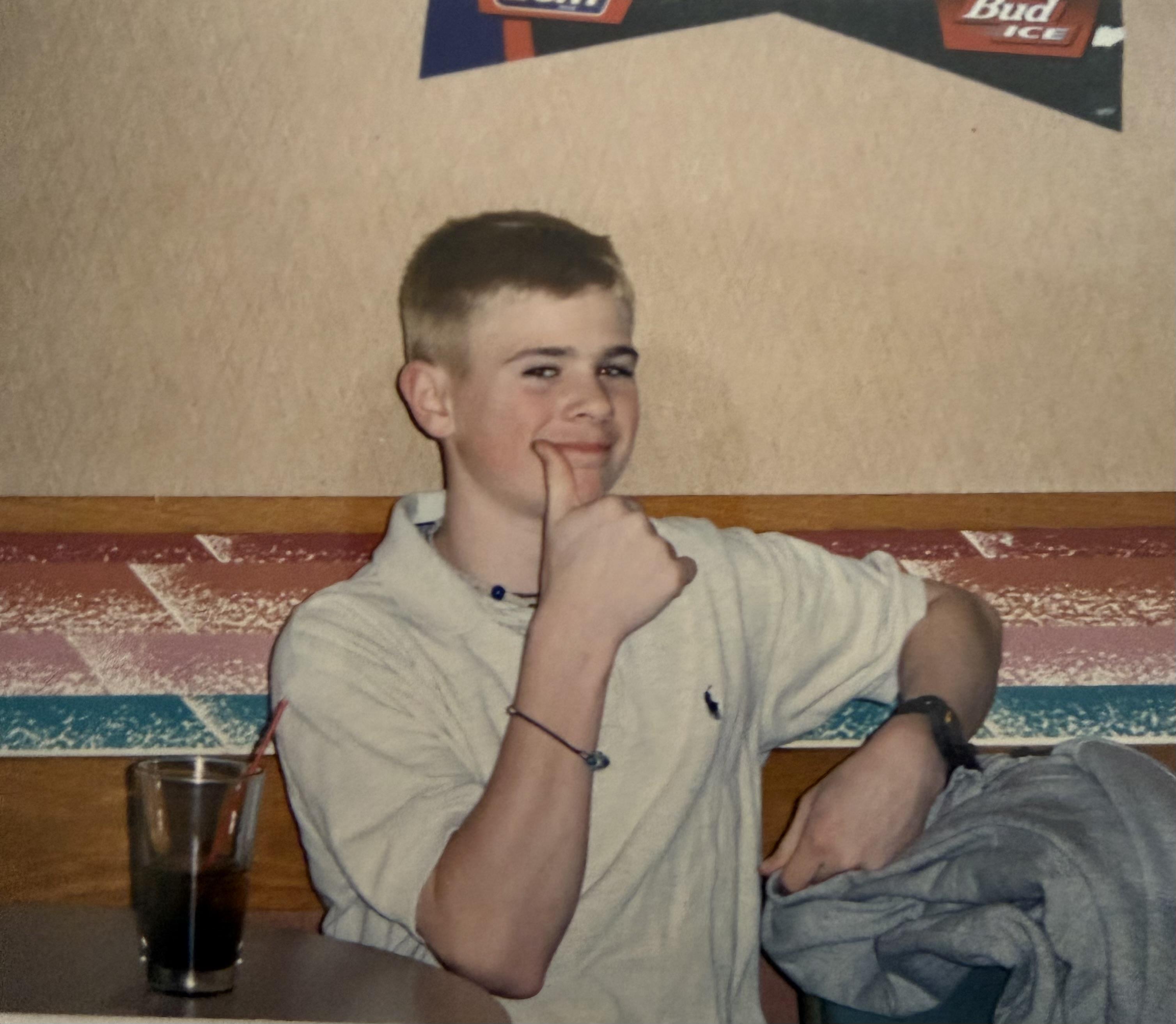 A boy with finger on his mouth