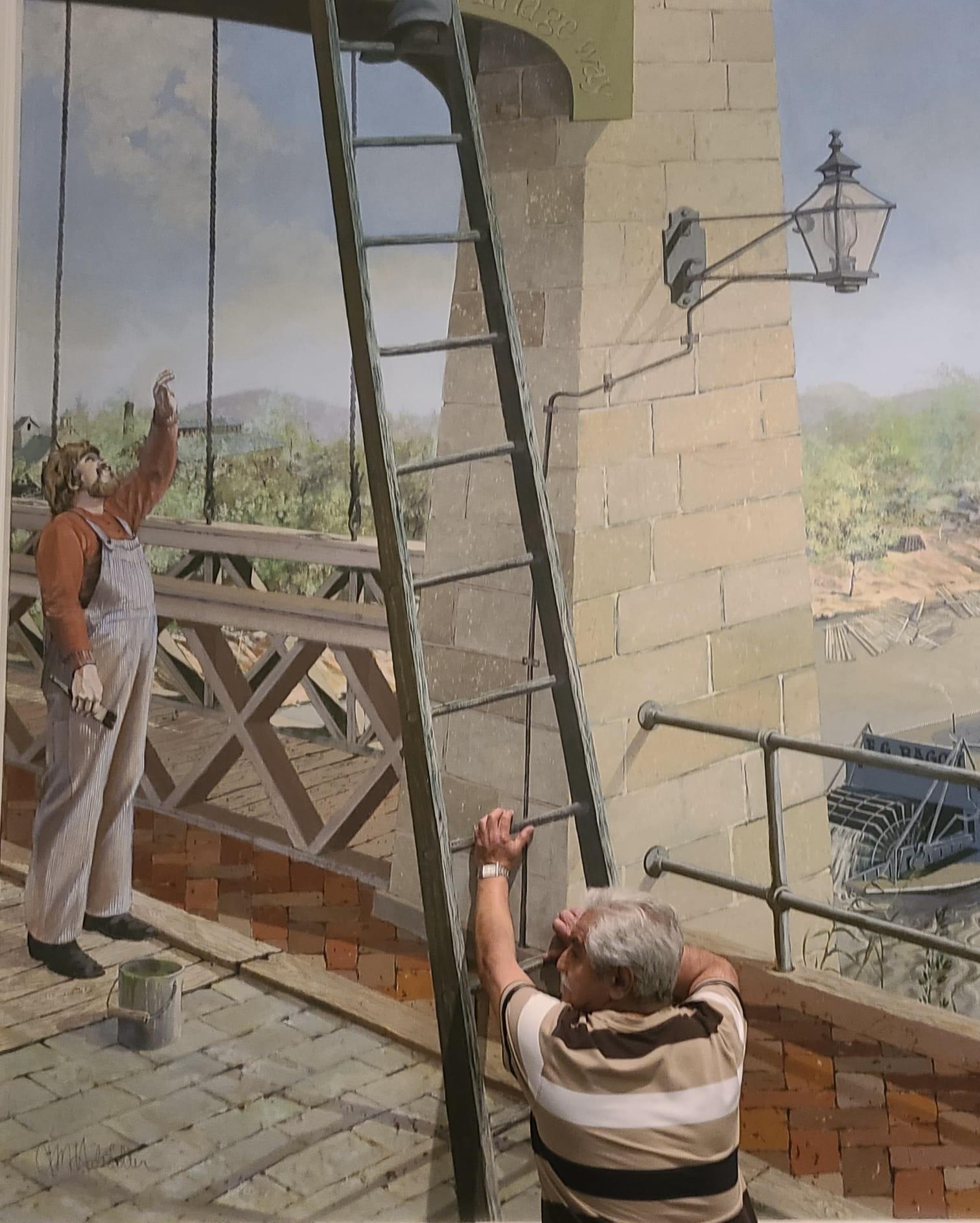 A man painting a mural