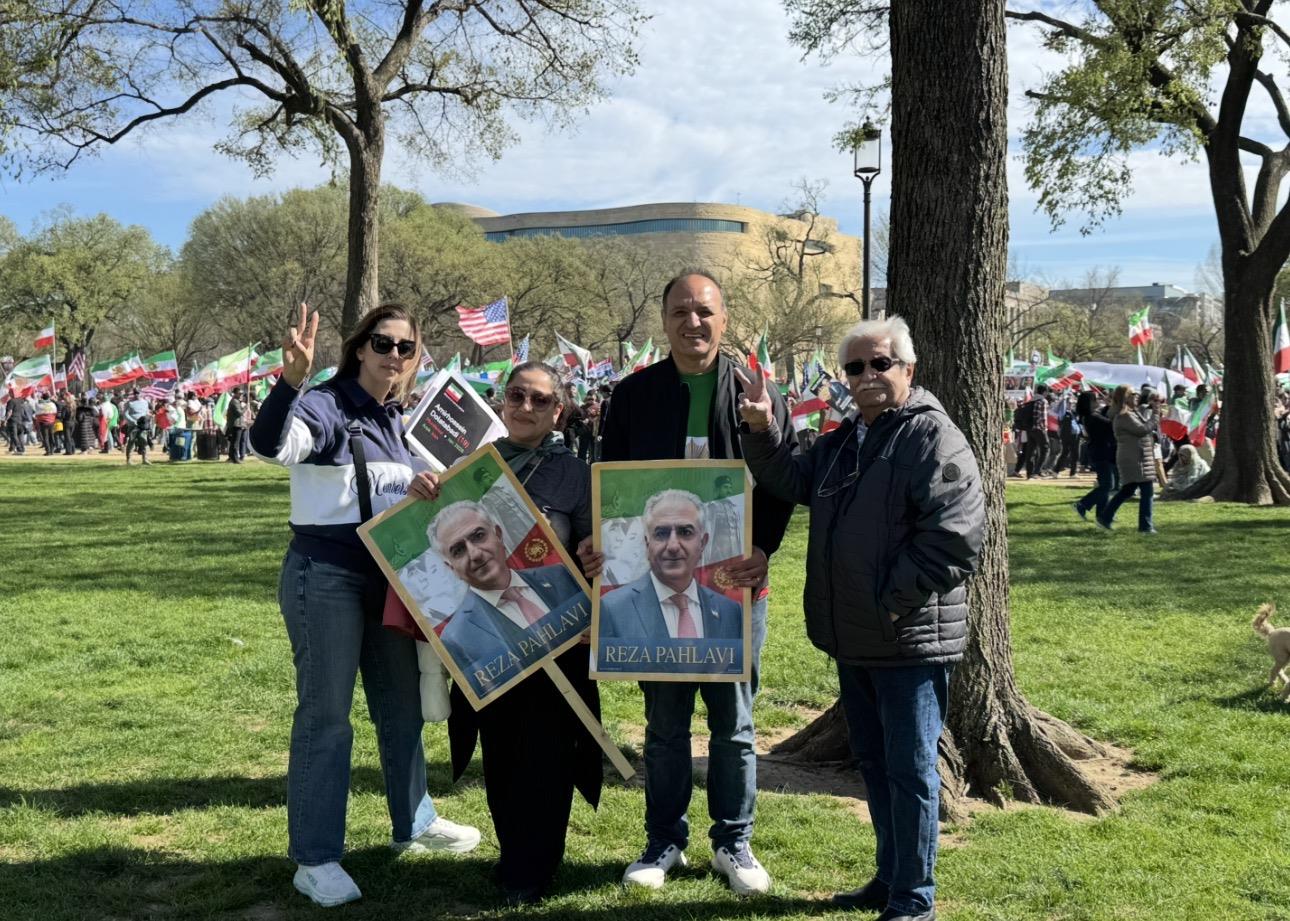 A group of people holding signs