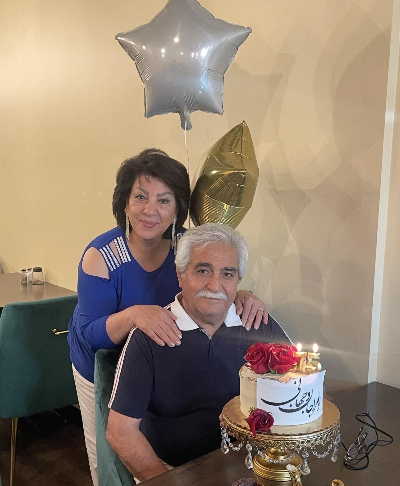 A woman and man posing for a picture