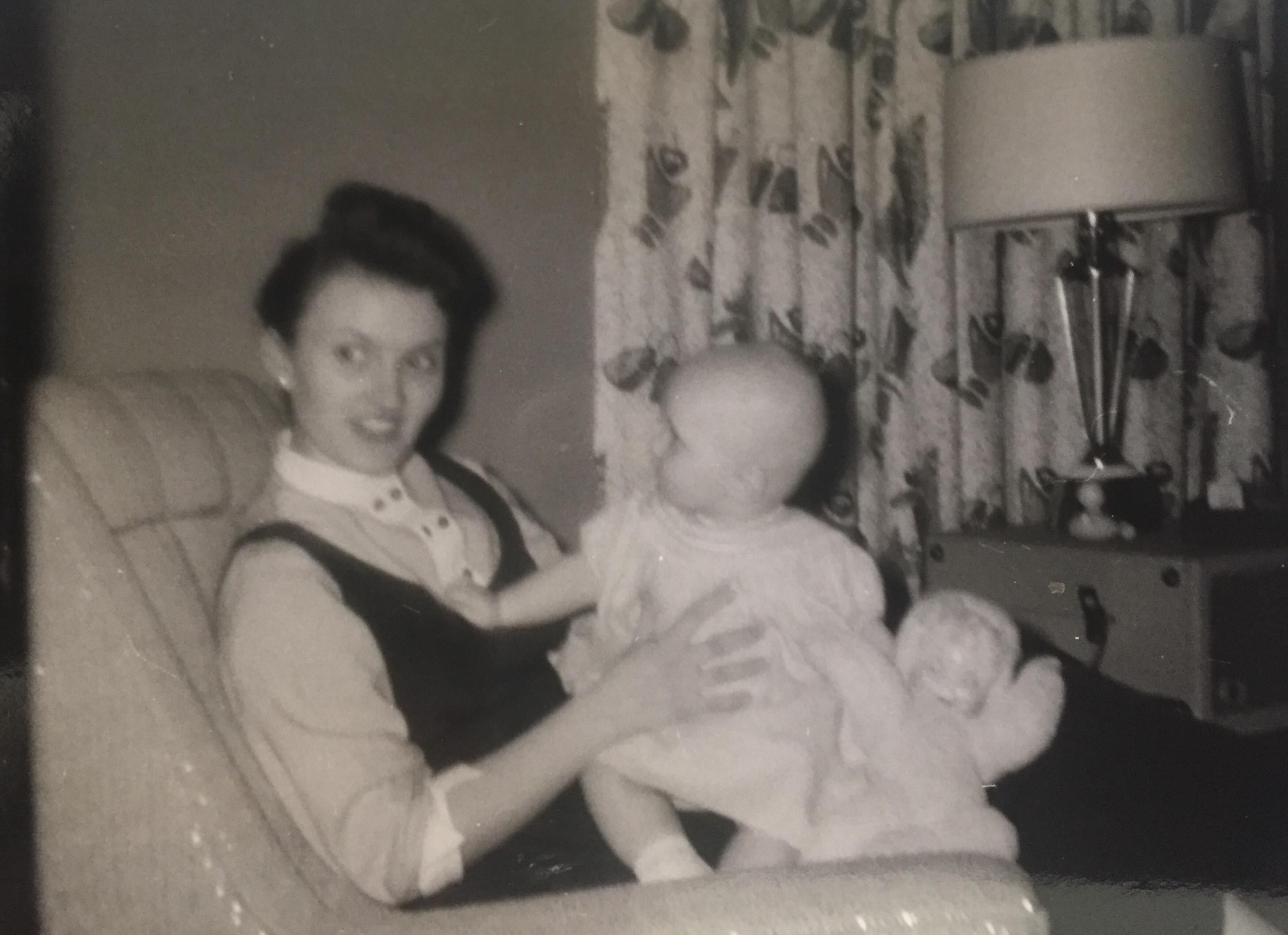 A woman holding a baby