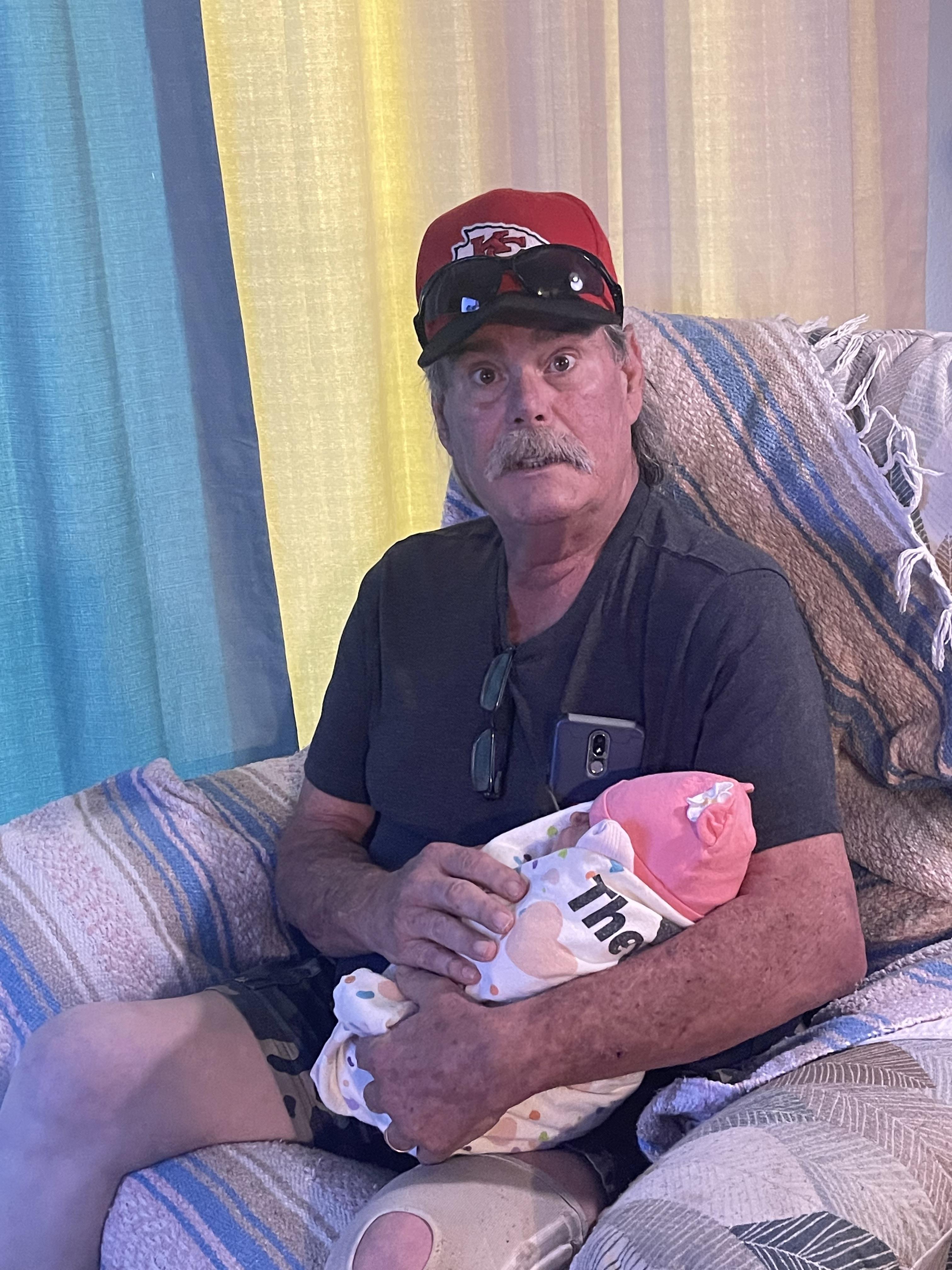 A man holding a baby
