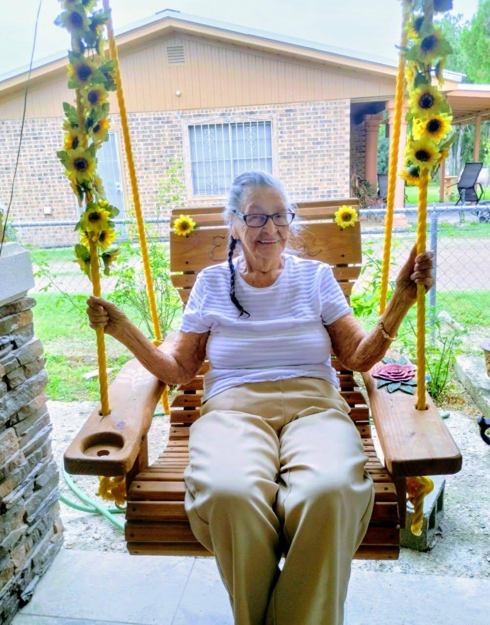 A woman sitting on a swing