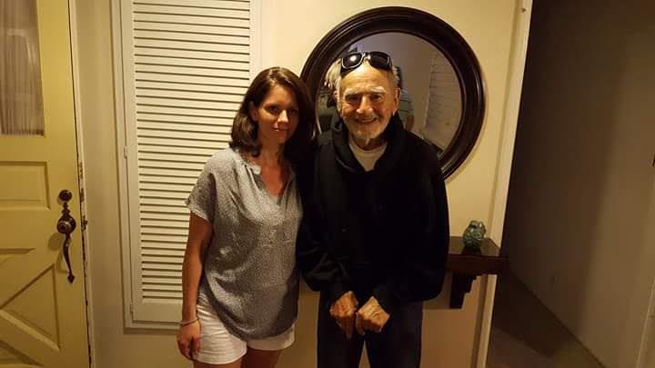 A woman standing next to a man