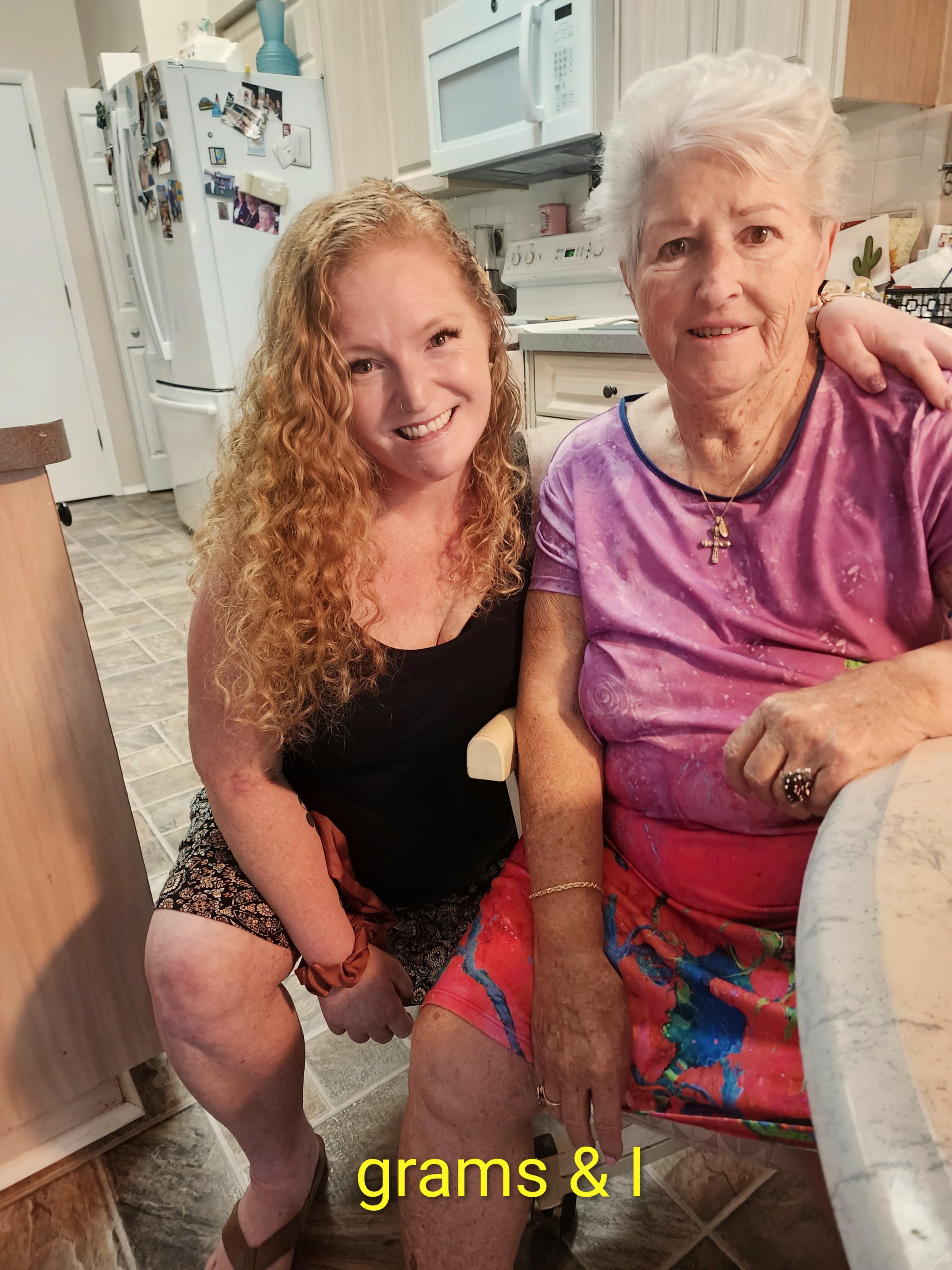 Two women sitting in a kitchen
