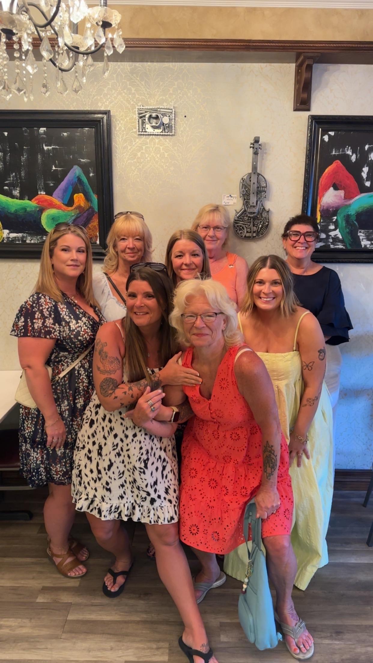 A group of women posing for a photo