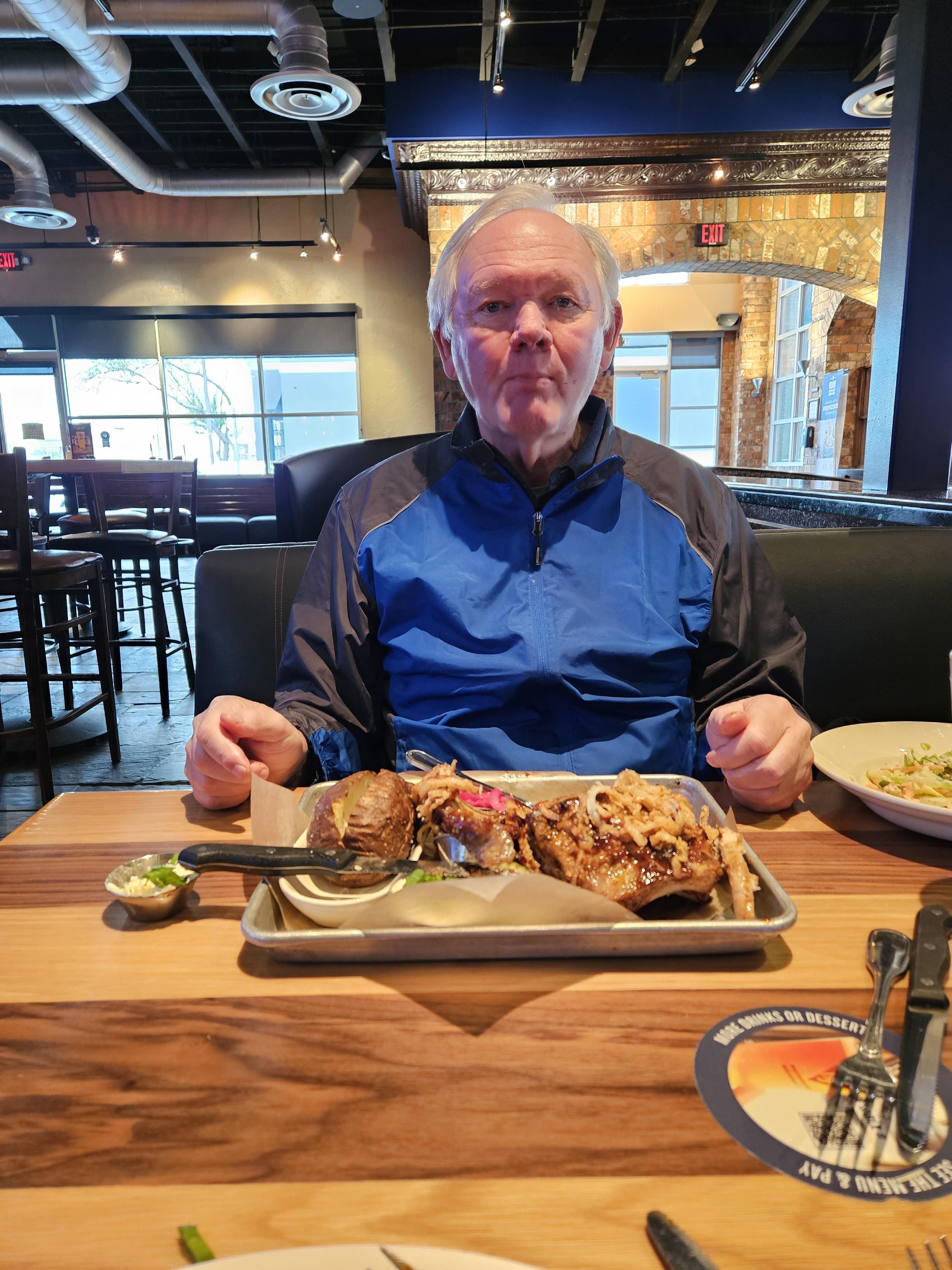 A man sitting at a table with food