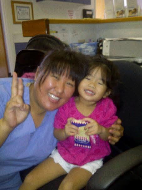 A woman and a child posing for a picture