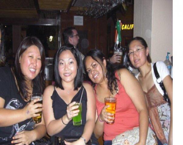 A group of women holding drinks
