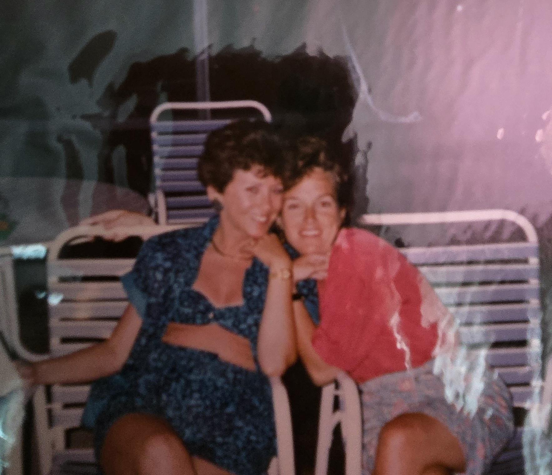 Two women sitting on a chair