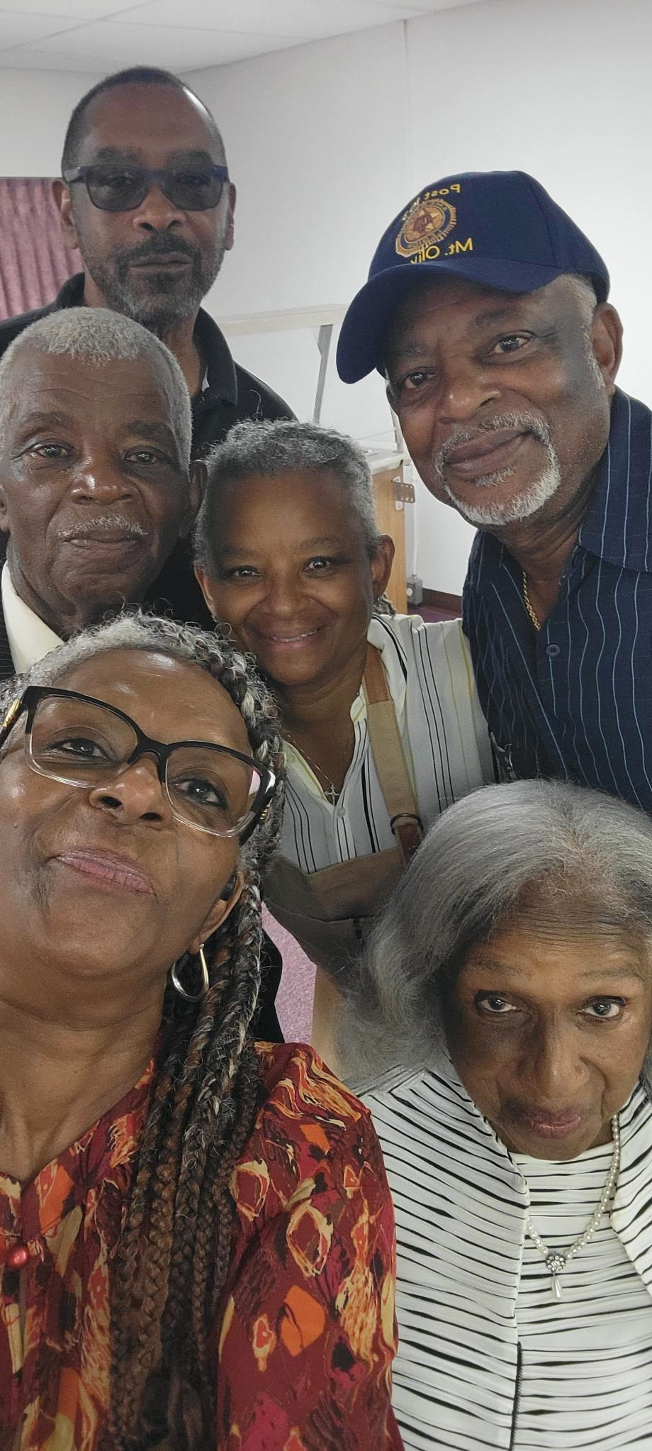 A group of people posing for a selfie