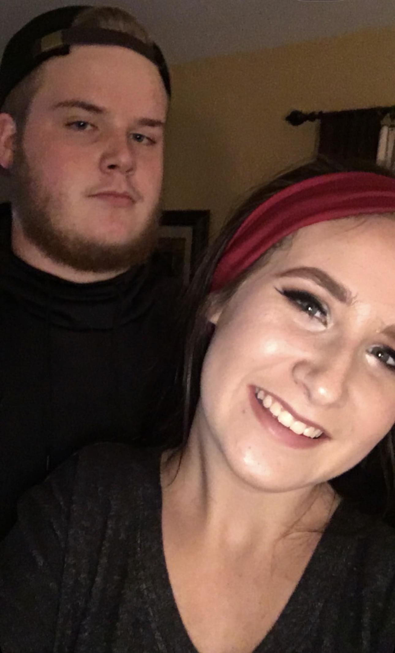 A man and woman taking a selfie