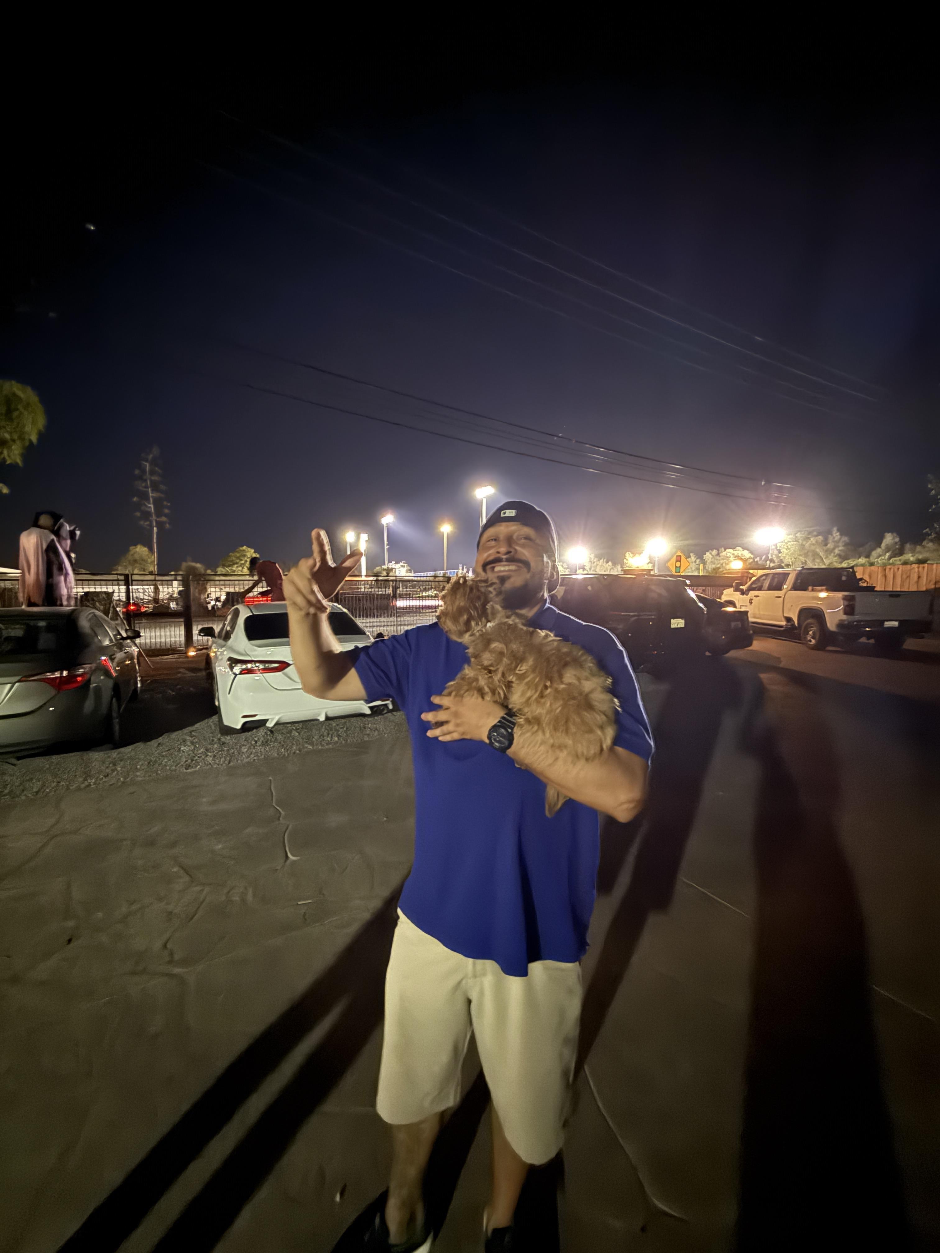 A man holding a dog