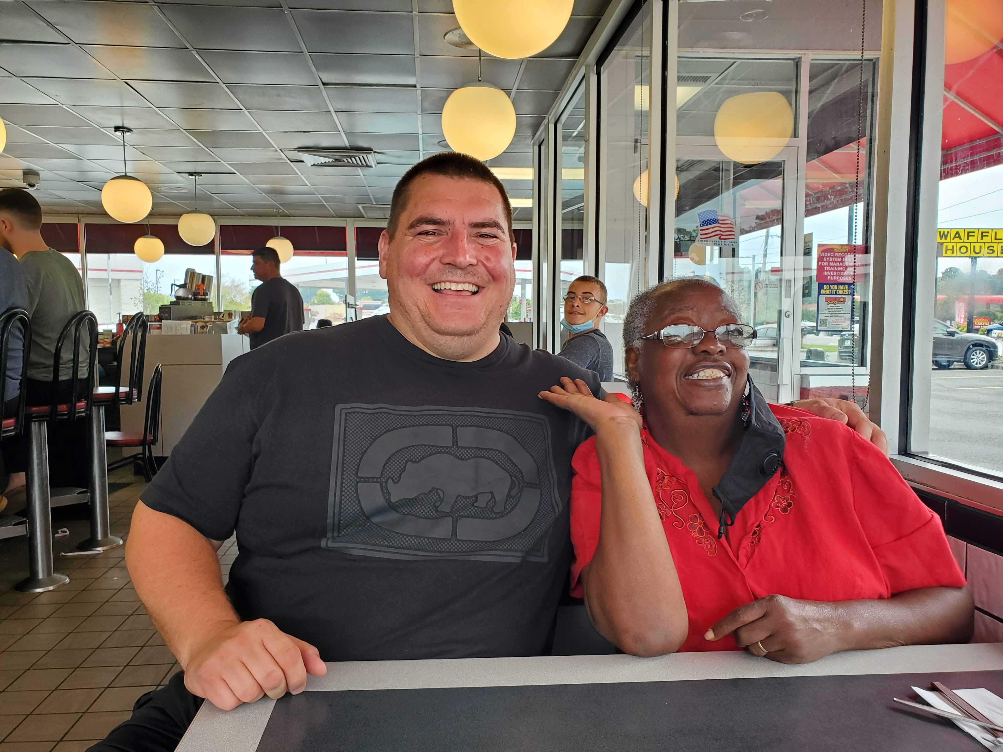 A man and woman sitting at a table