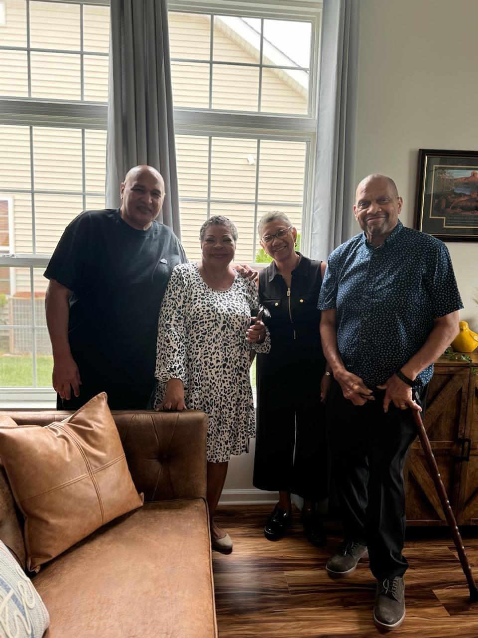 A group of people standing in a room
