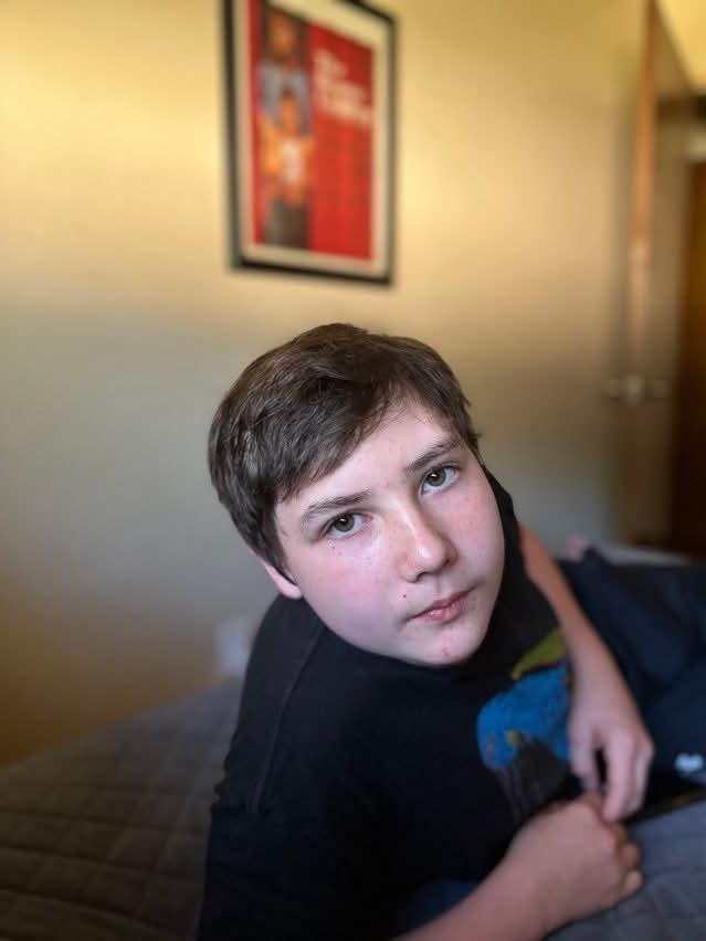 A boy lying on a bed