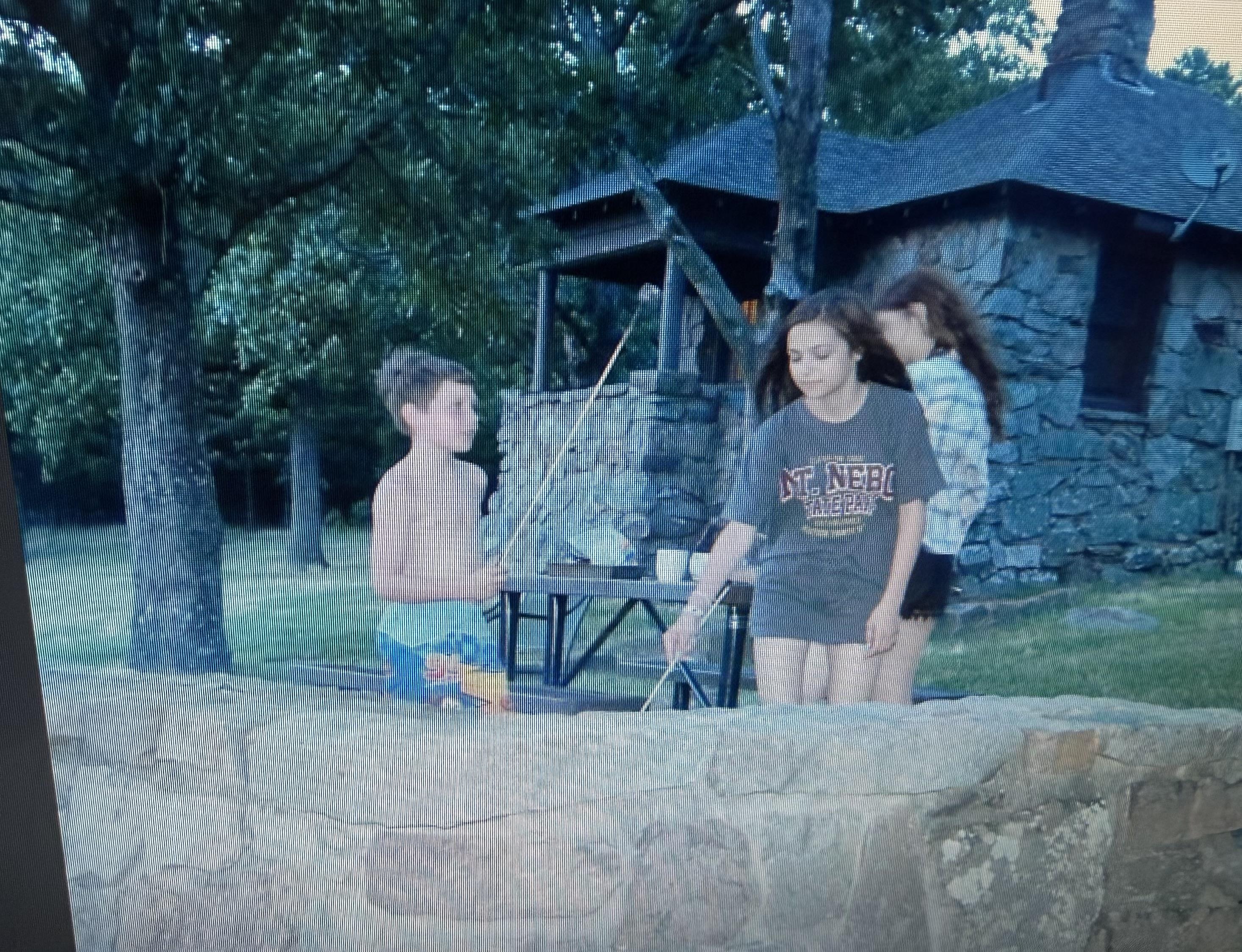 A group of kids standing around a table