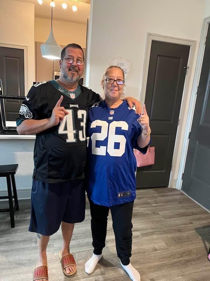 A man and woman posing for a picture