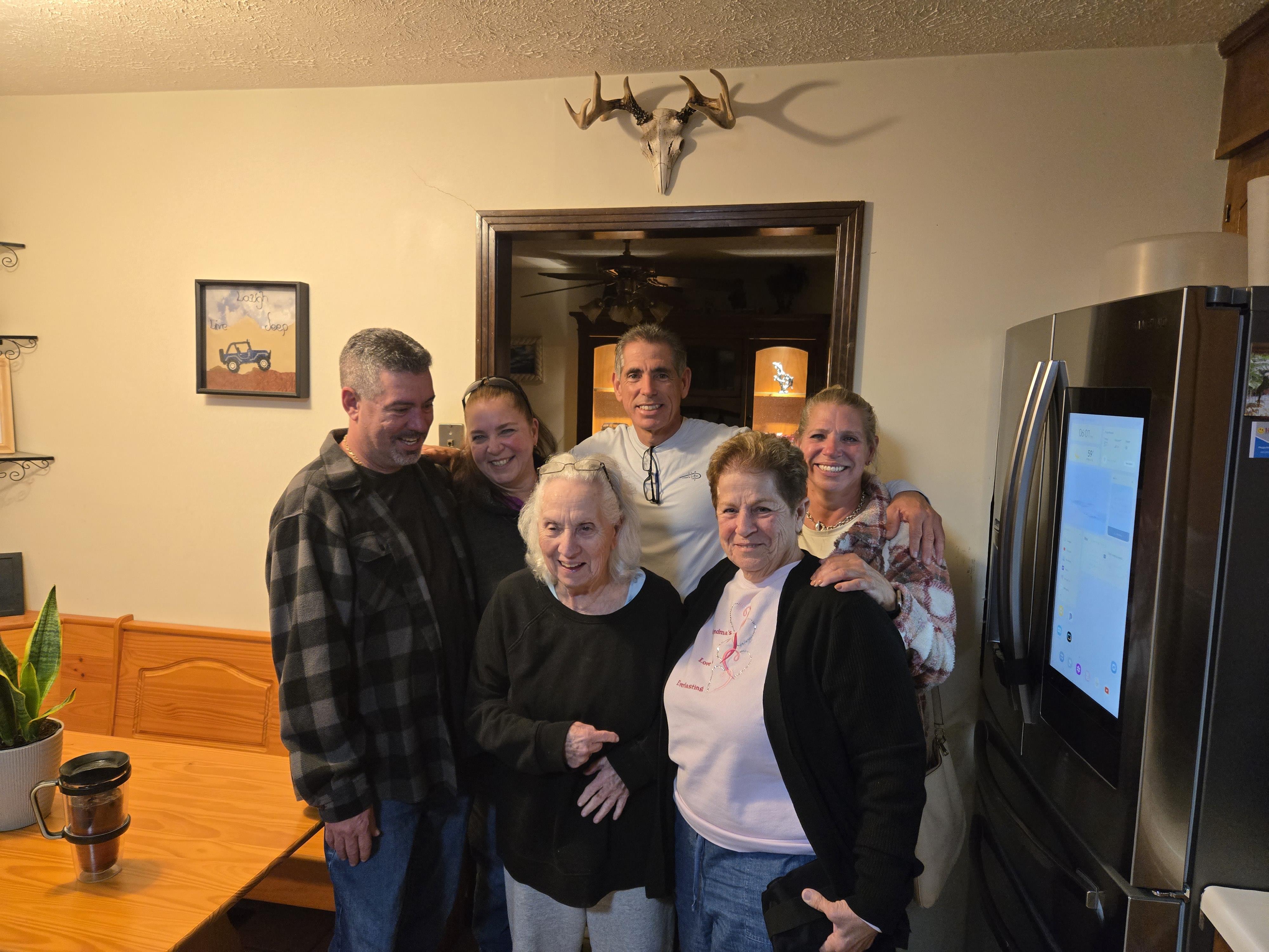 A group of people standing in a room