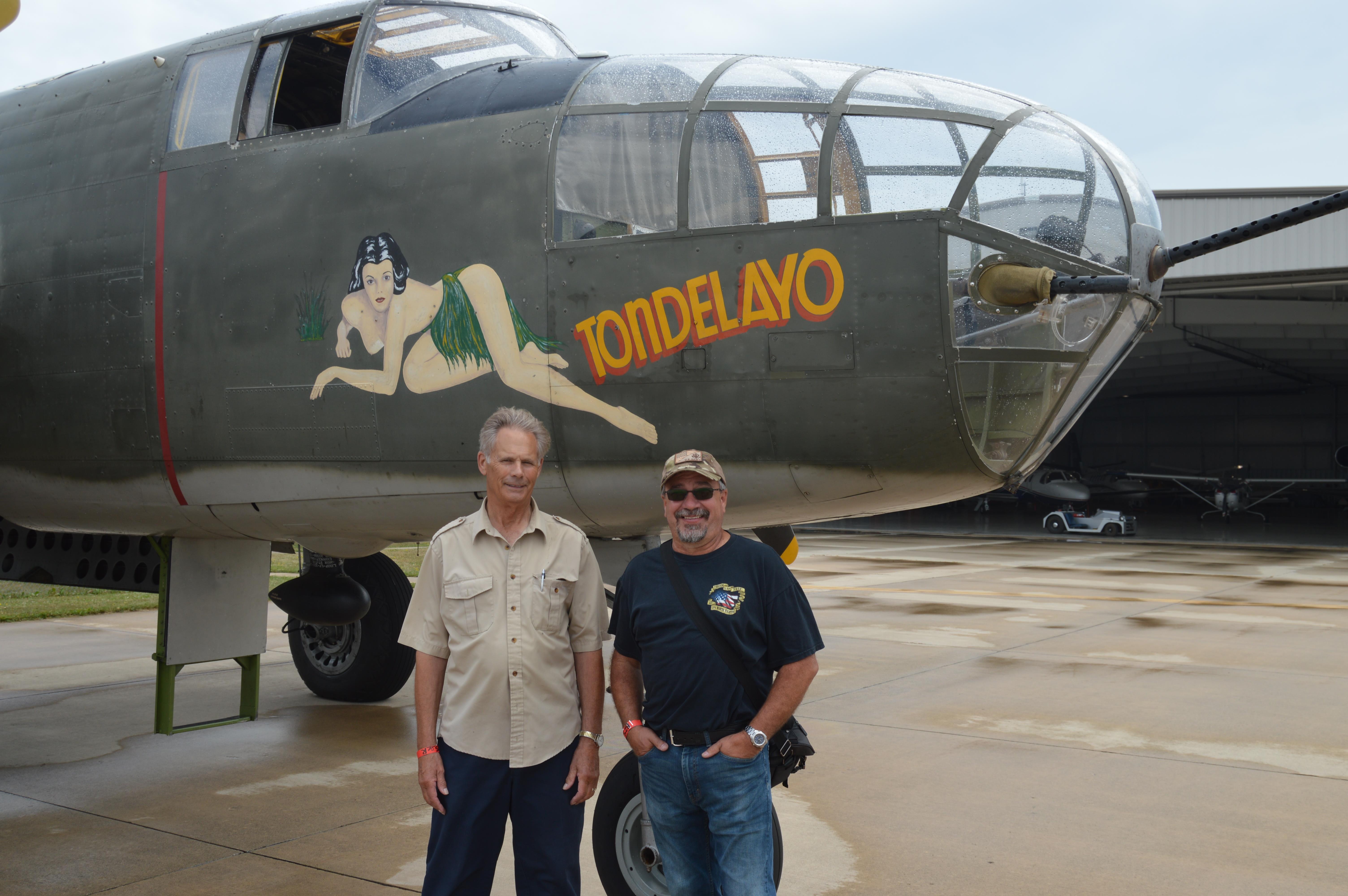 Men standing in front of an airplane