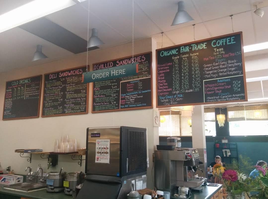 A restaurant with menus and coffee machines