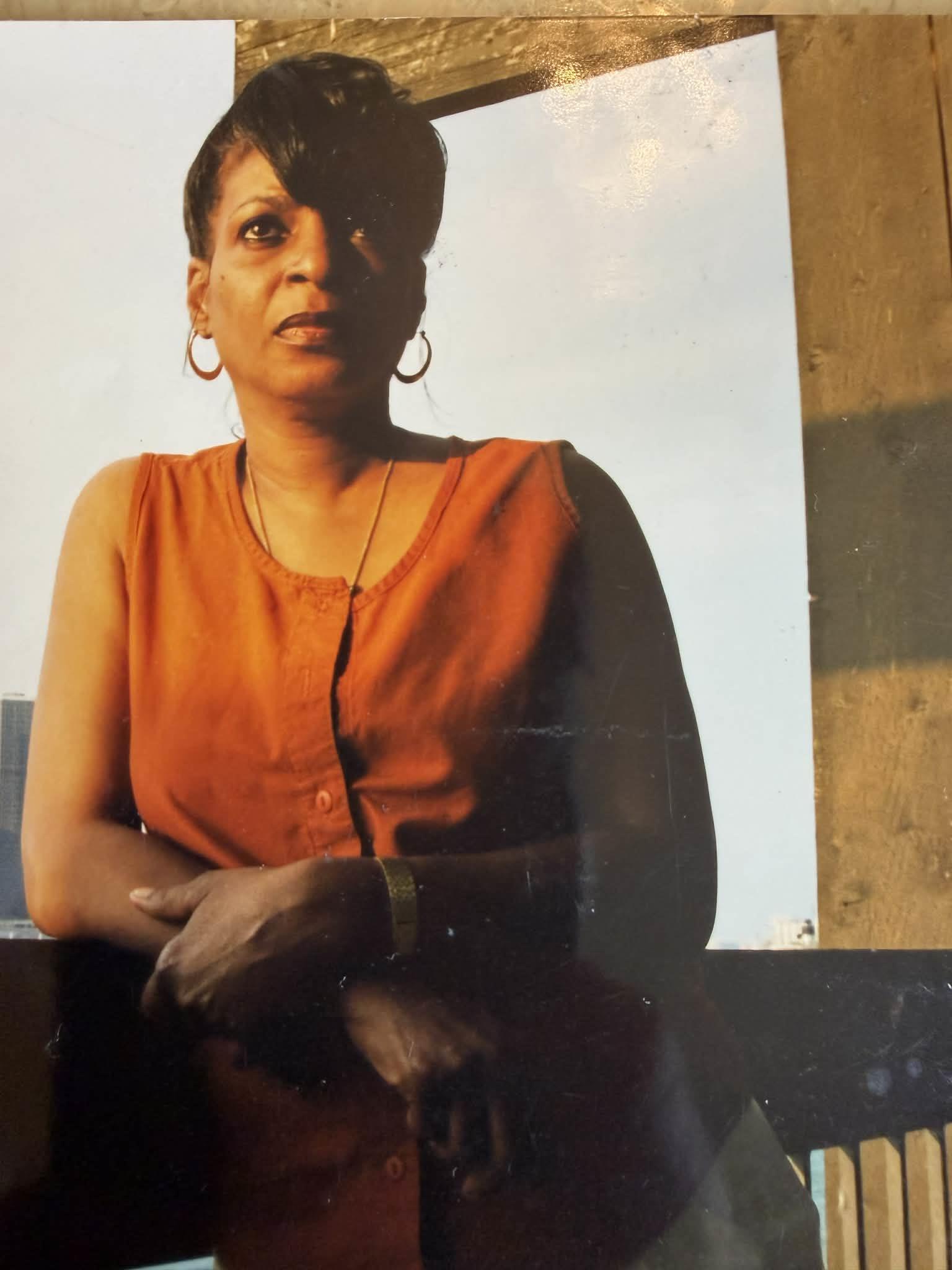 A woman in an orange shirt