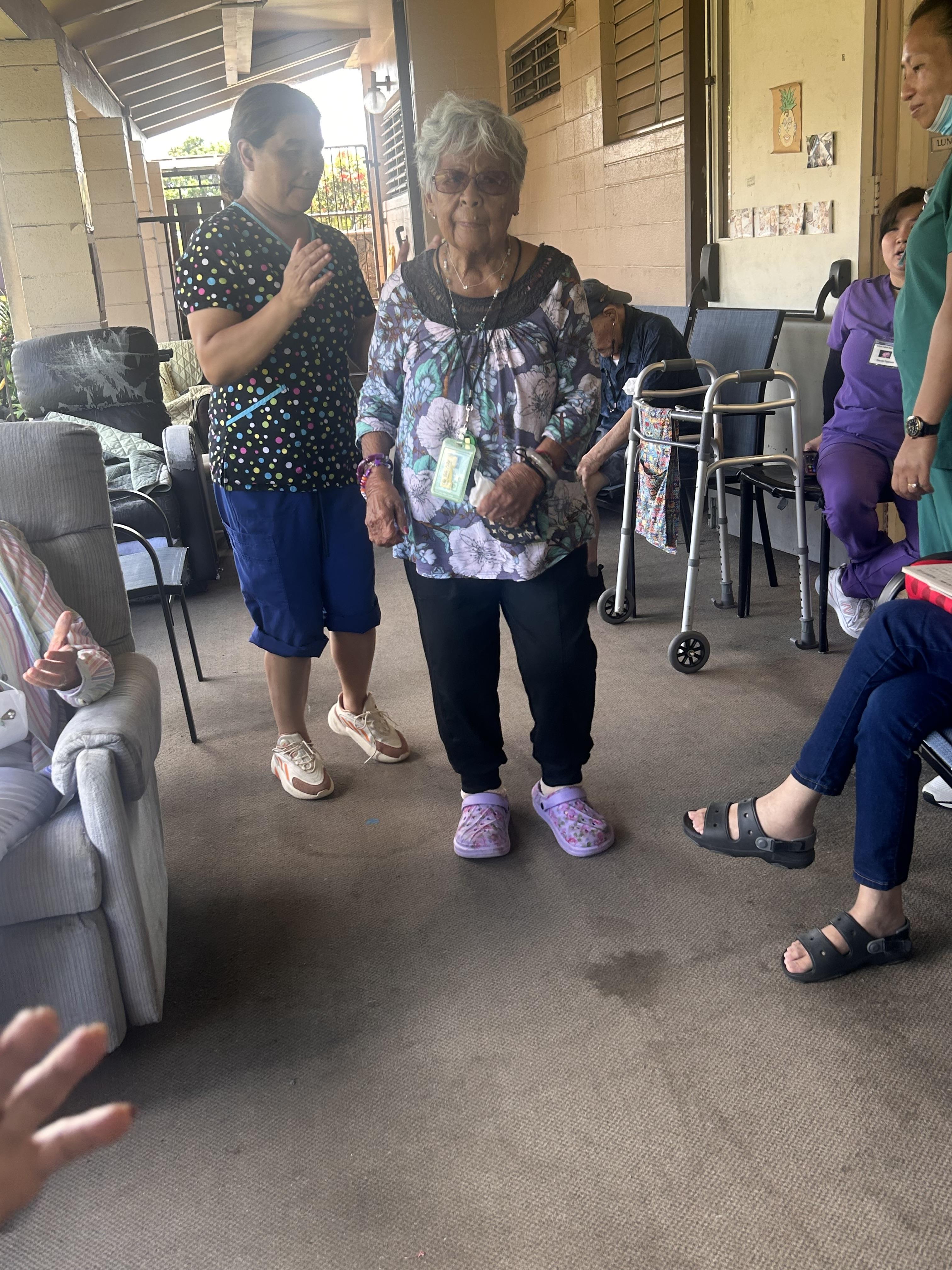 A group of people standing in a room