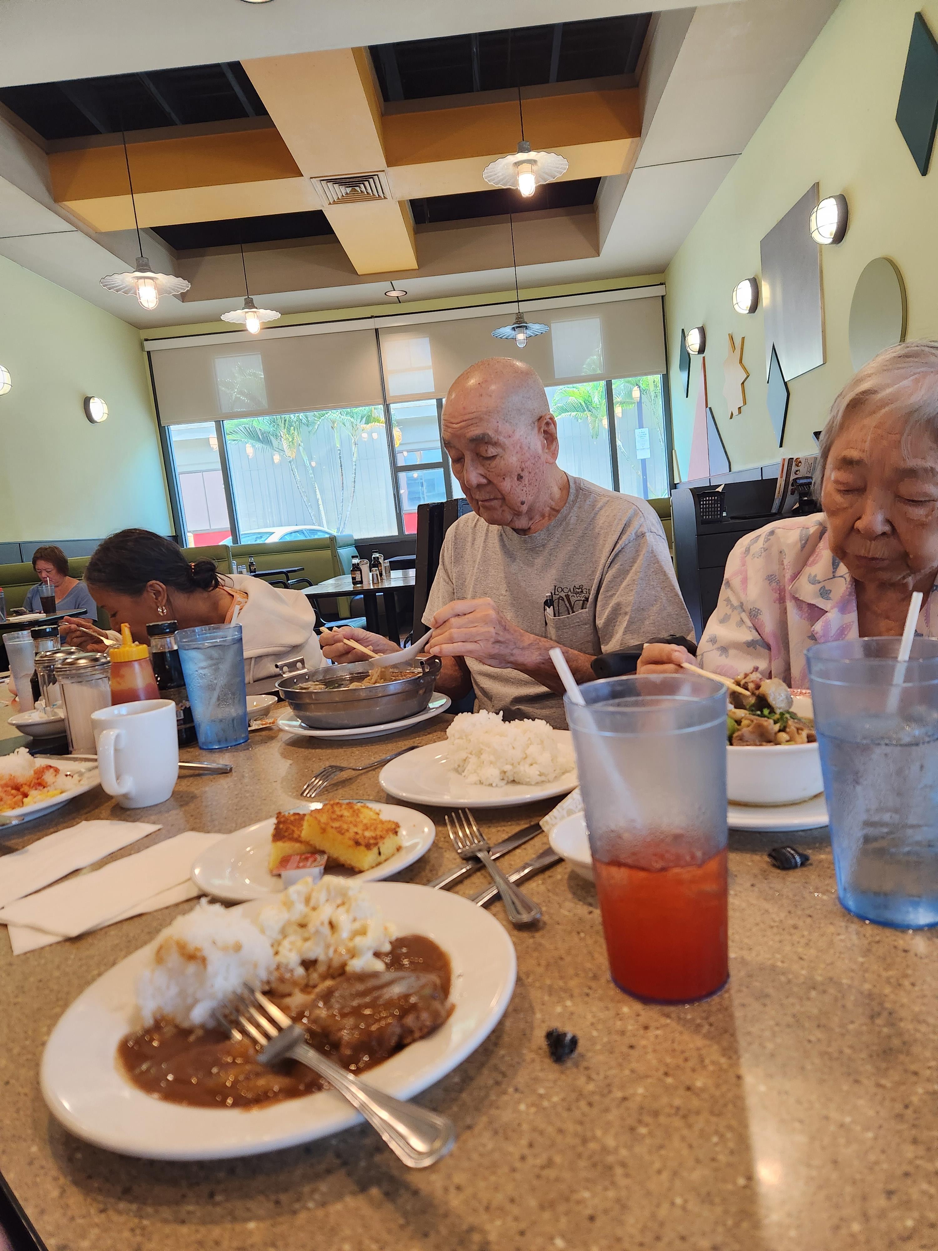 A group of people eating at a restaurant