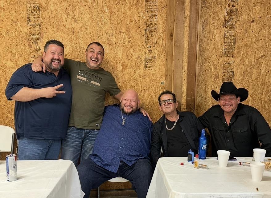 A group of men posing for a picture