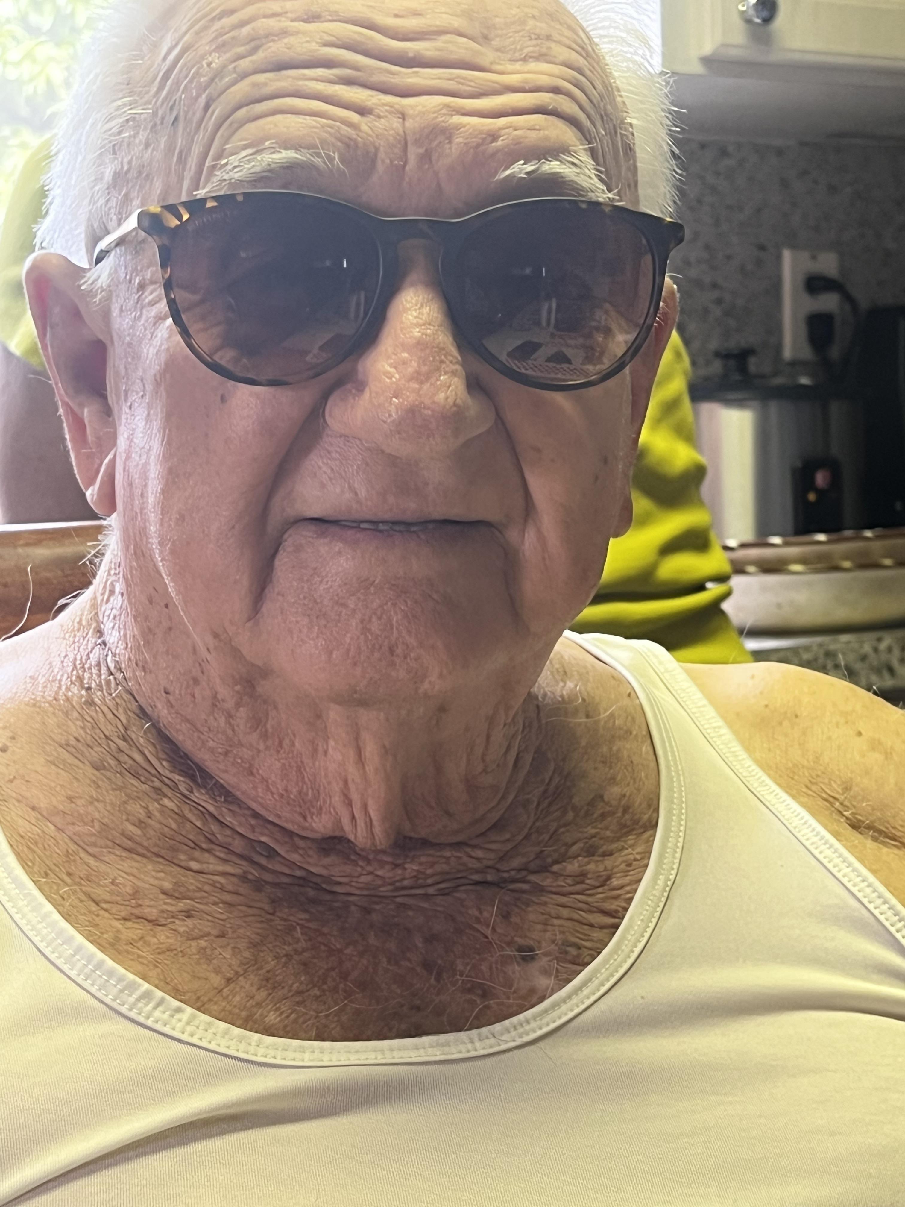 An old man wearing sunglasses