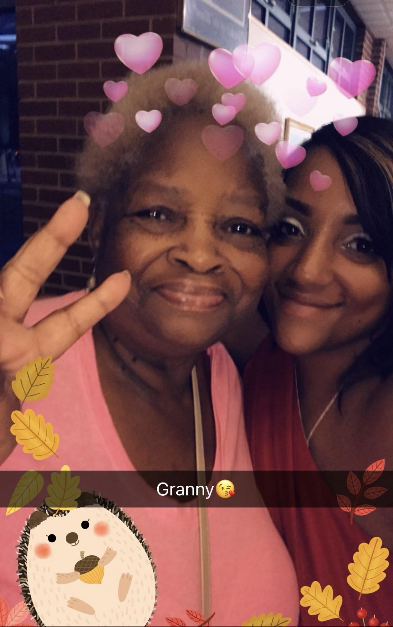 A woman taking a selfie with a woman