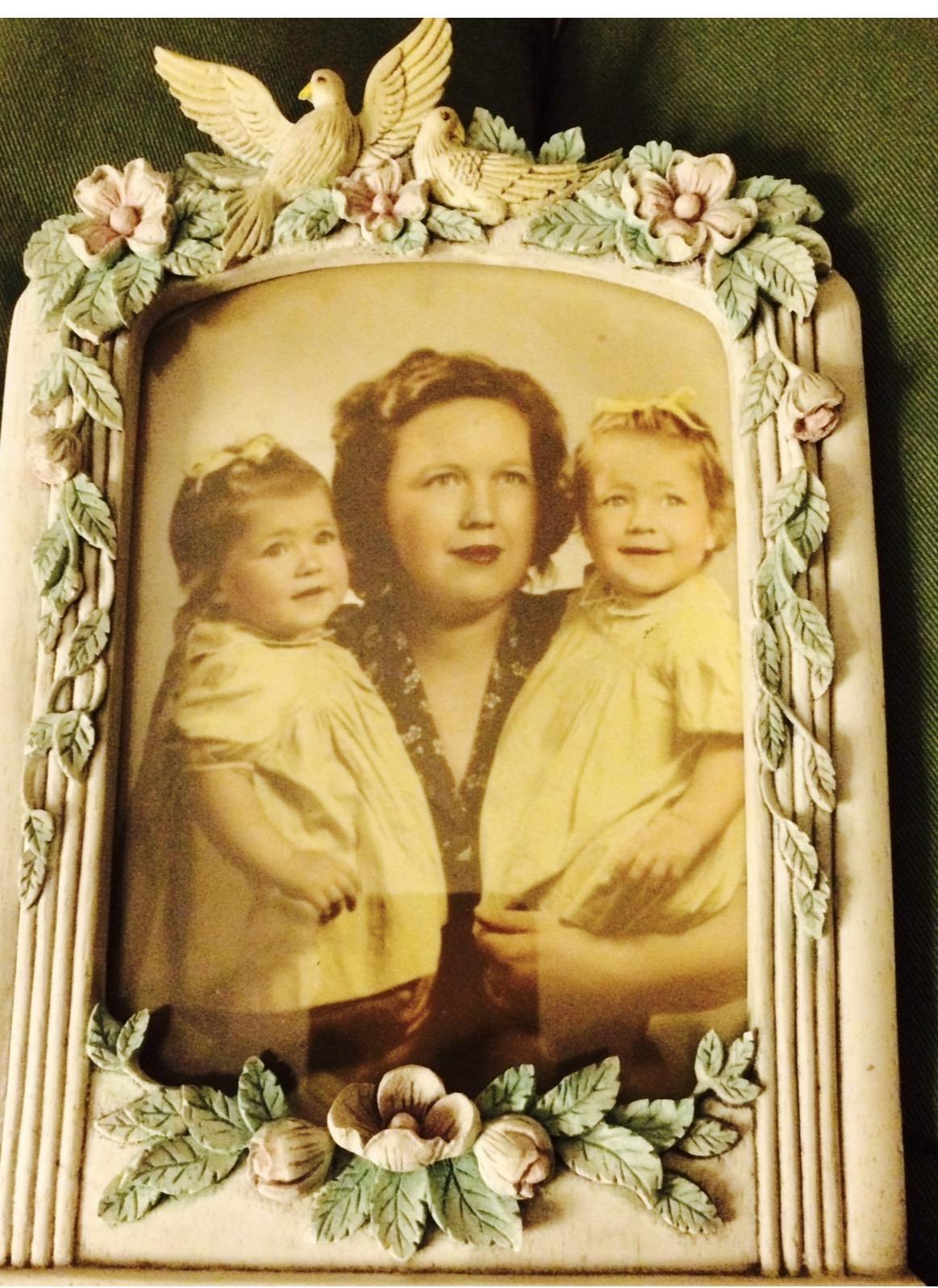 A woman and two children in a frame